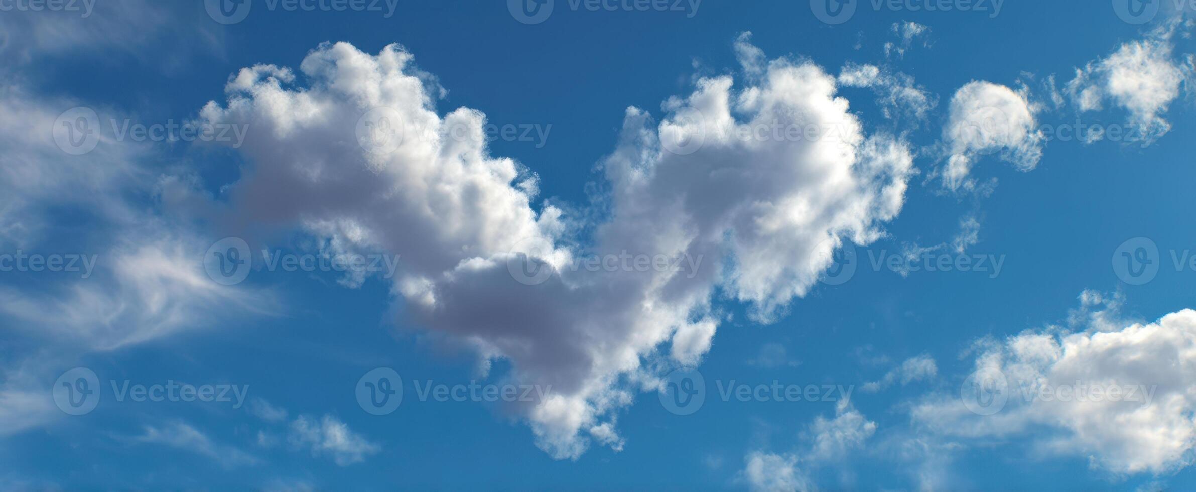 The Heart-Shaped Clouds Against a Bright Blue Sky photo