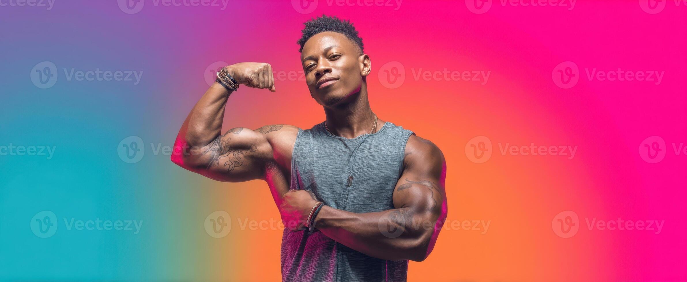 The strong man flexing muscles against a vibrant, colorful background. photo