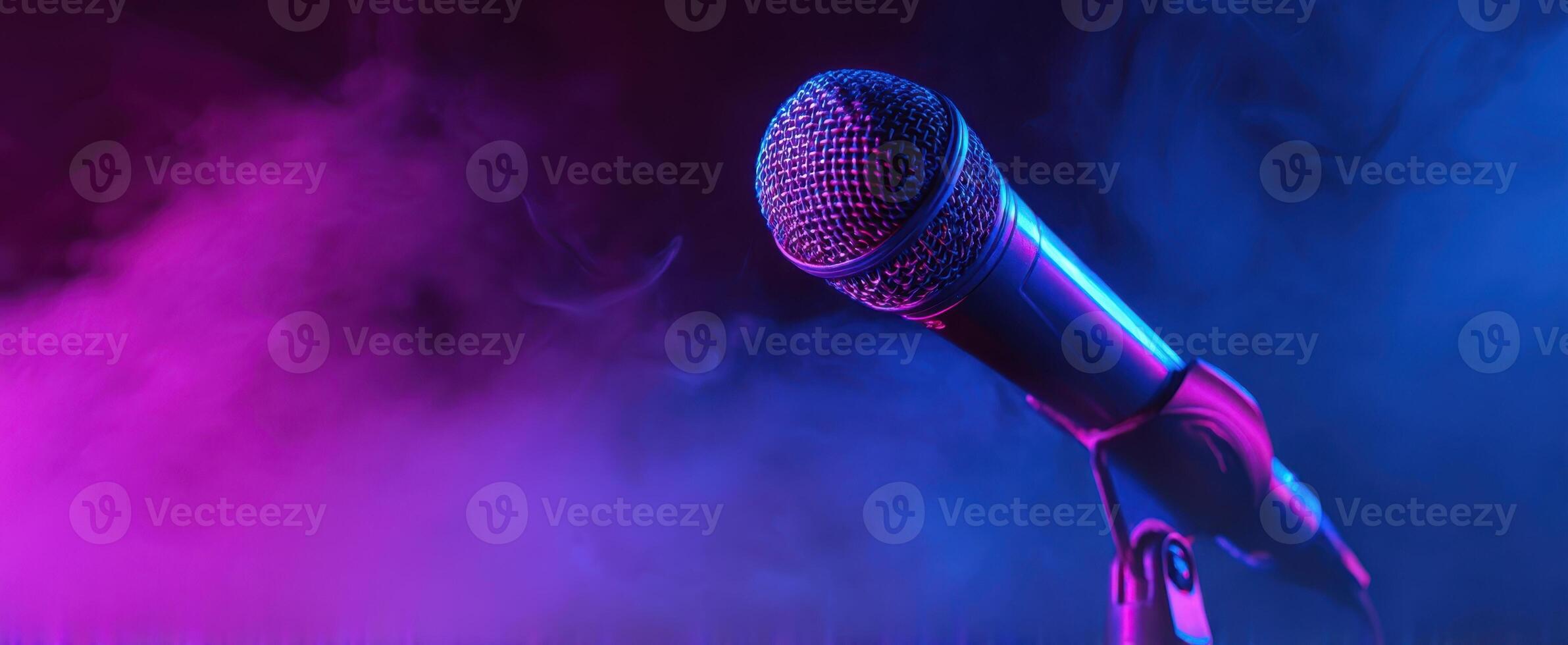 The vibrant microphone standing amidst colorful fog lighting up the stage. photo