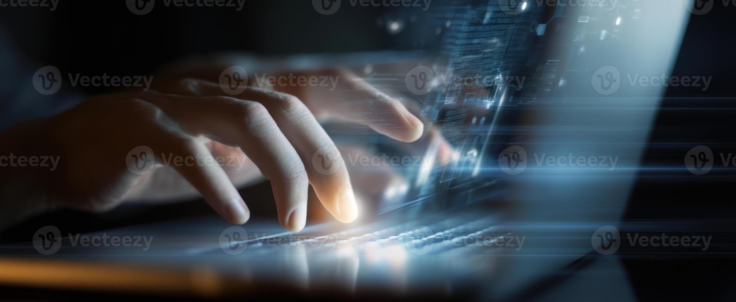 The hands typing on a laptop with a futuristic digital interface. photo