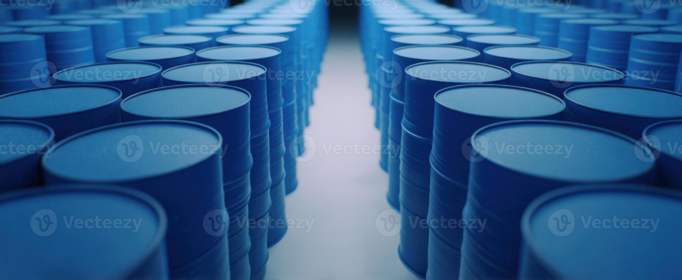 The rows of blue barrels lined up in a large storage facility. photo
