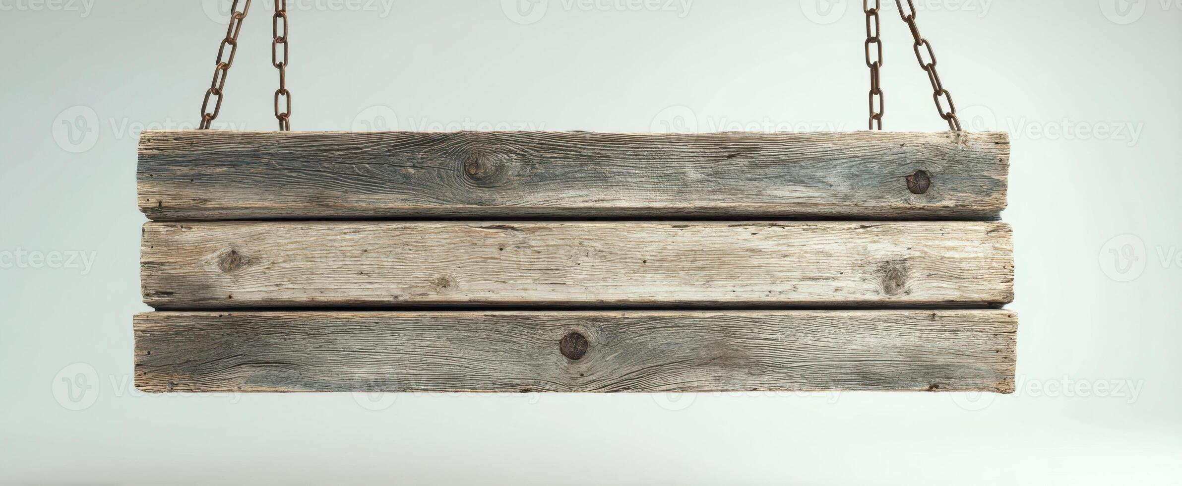 The rustic wooden sign hanging from chains against a plain background. photo