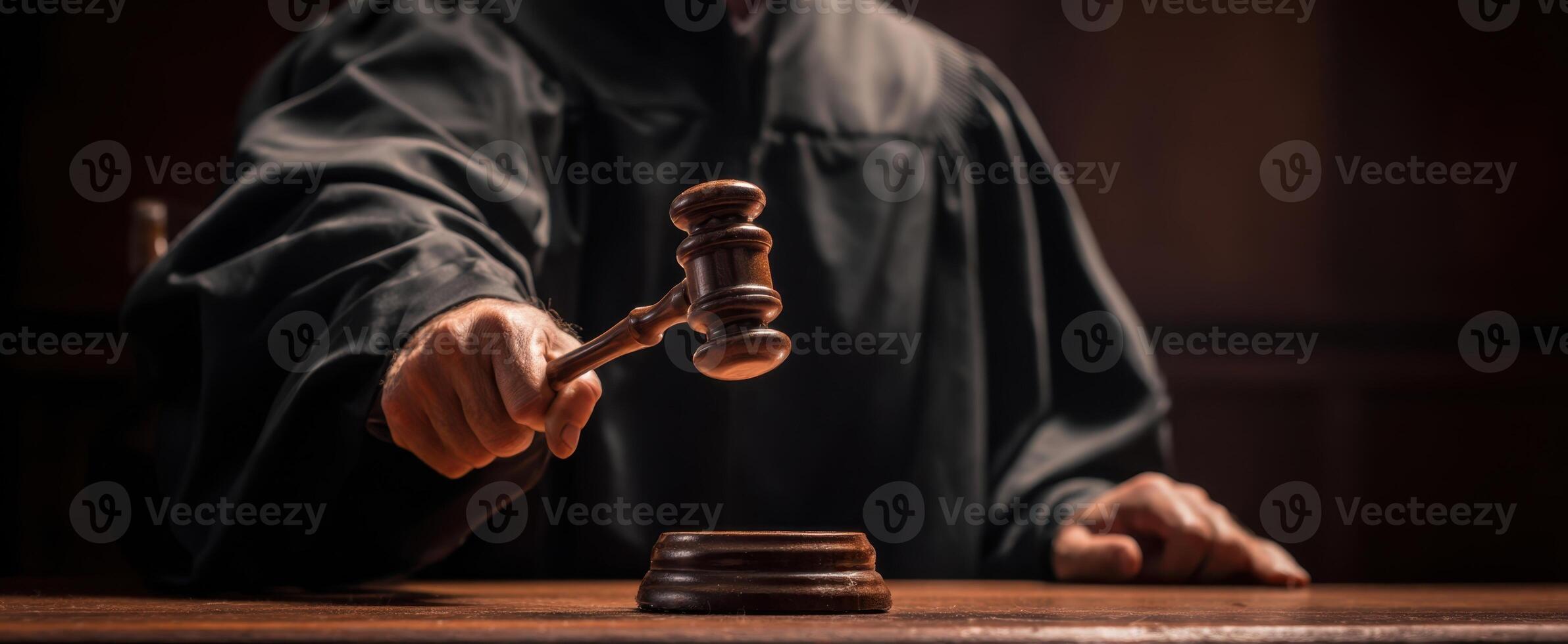 The judge raises the gavel to announce a significant court ruling. photo