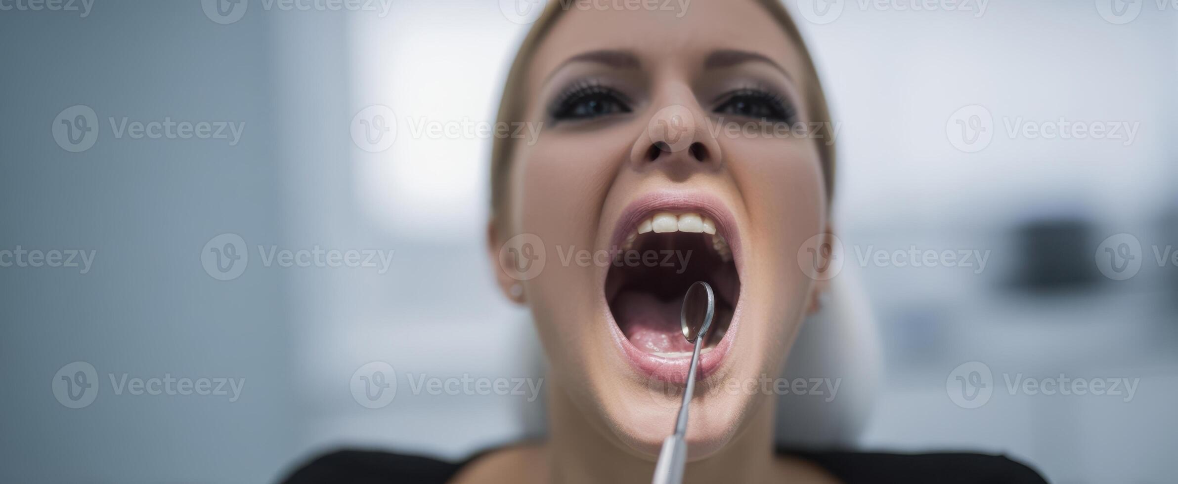 The dentist examining a patient's mouth during a routine dental checkup. photo