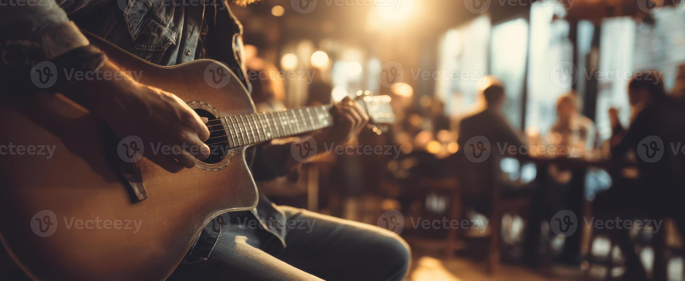The passionate musician playing guitar in a lively cafe atmosphere. photo