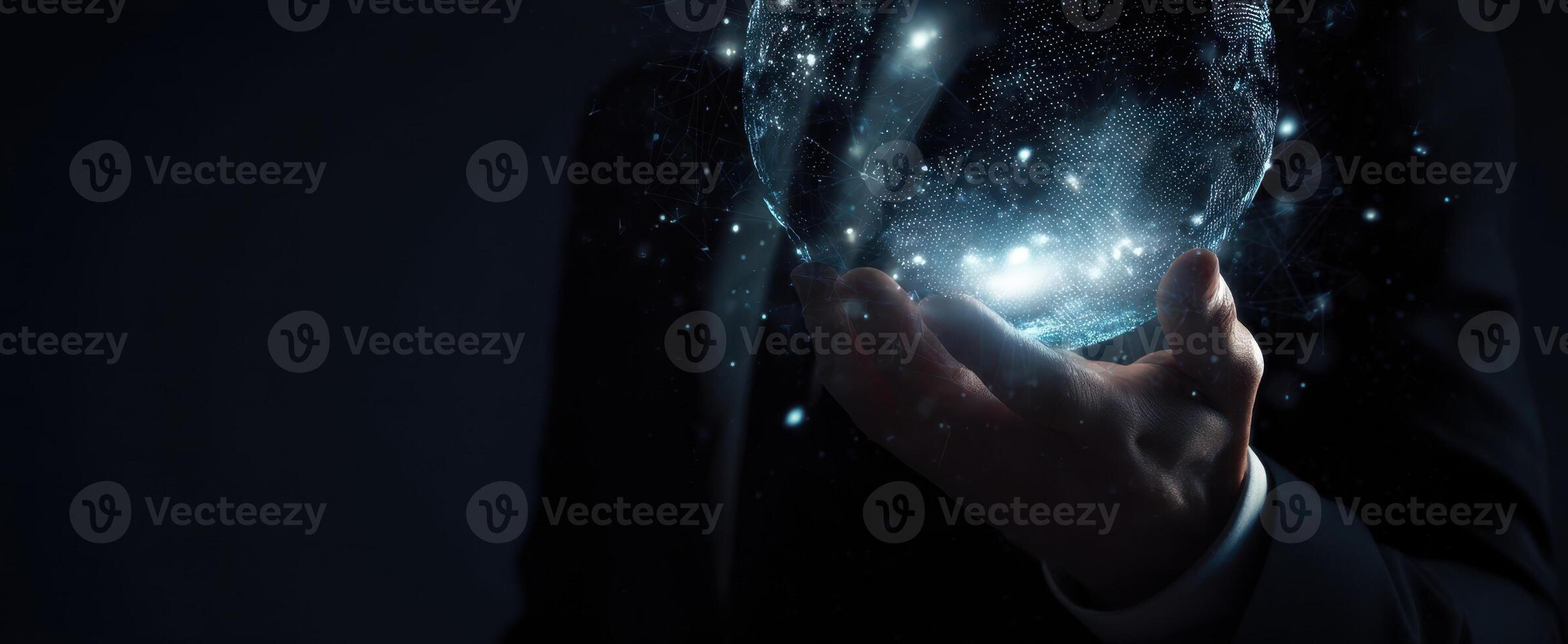The glowing globe held by a businessman in a dark and mysterious setting photo