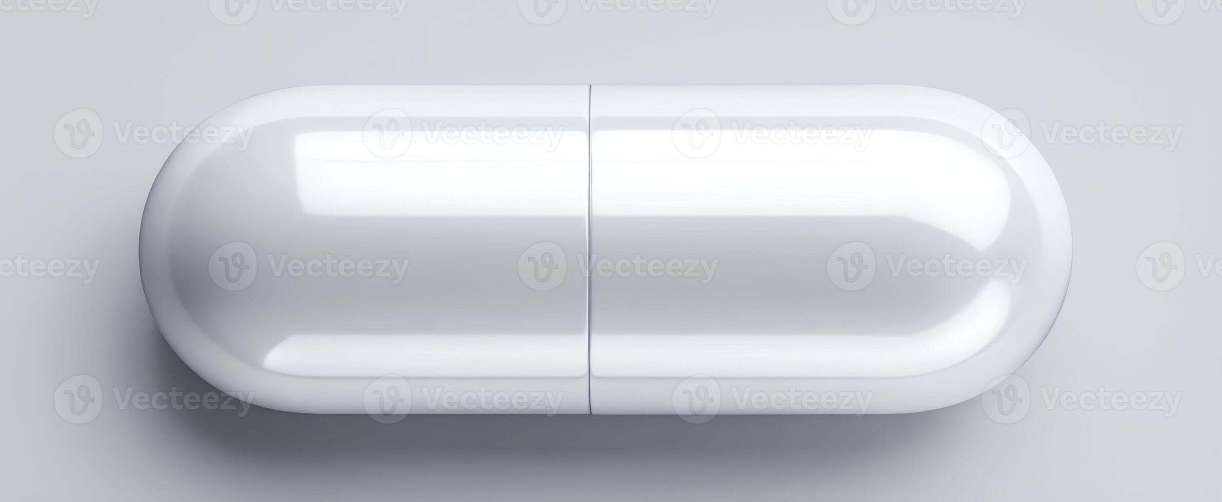 The sleek white capsule on a gray background showcasing modern pharmaceuticals. photo