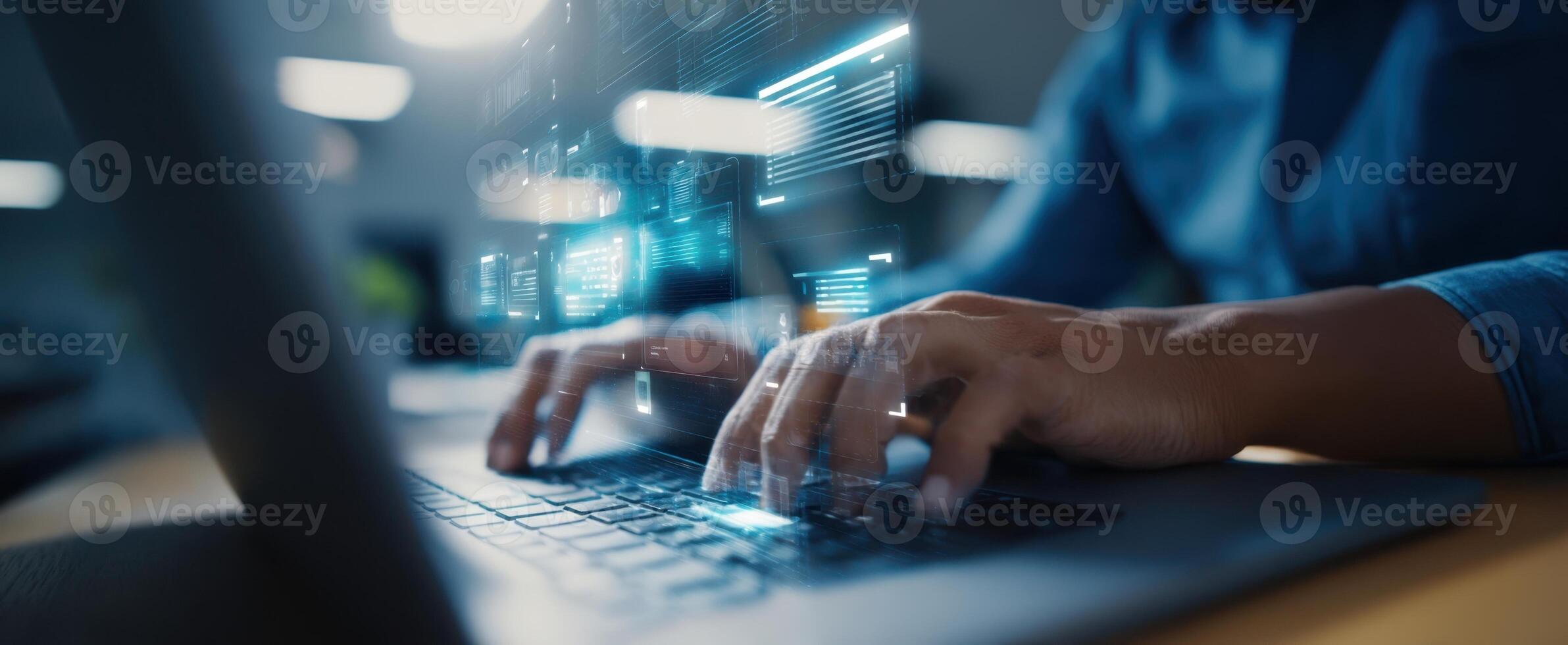 The hands of a professional typing on a laptop with digital graphics emerging. photo