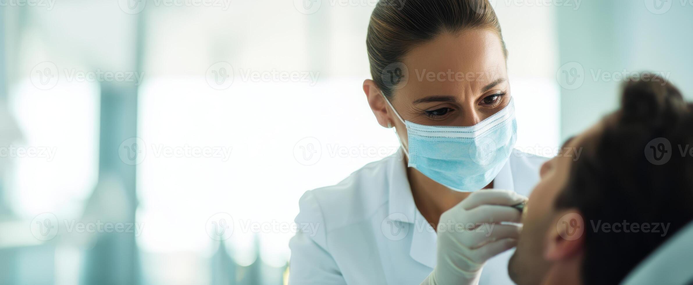 The dentist performing a check-up on a patient in a modern clinic setting. photo