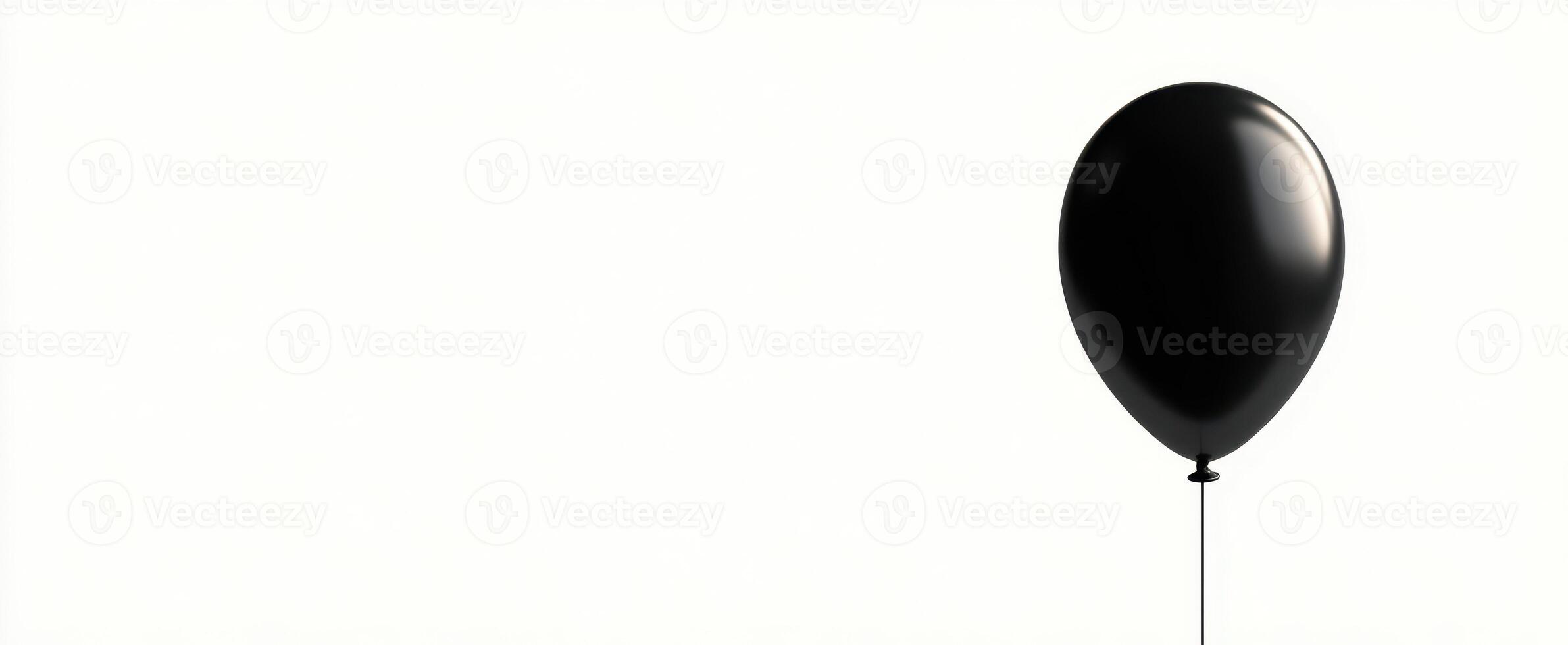 The elegant black balloon floating gracefully against a minimalist background. photo