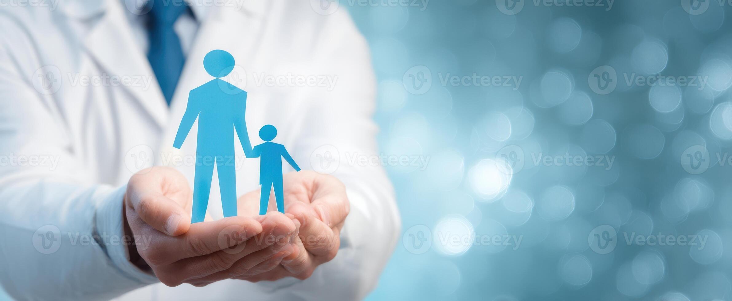The caregiver holding figures of a parent and child in a supportive gesture. photo