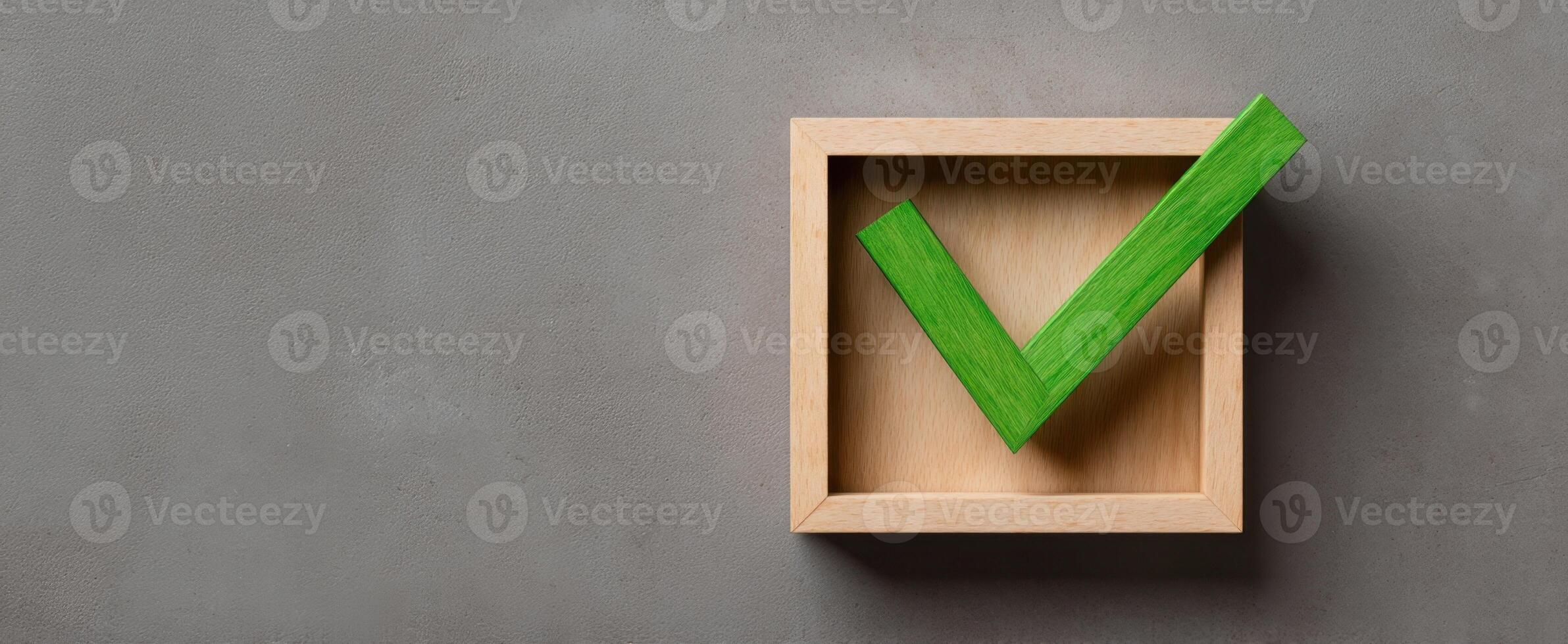 The green checkmark inside a wooden box symbolizing approval and success. photo