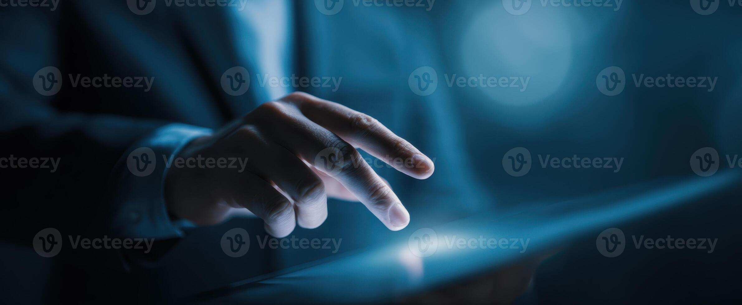 The hand engaging with a tablet in a modern business environment. photo