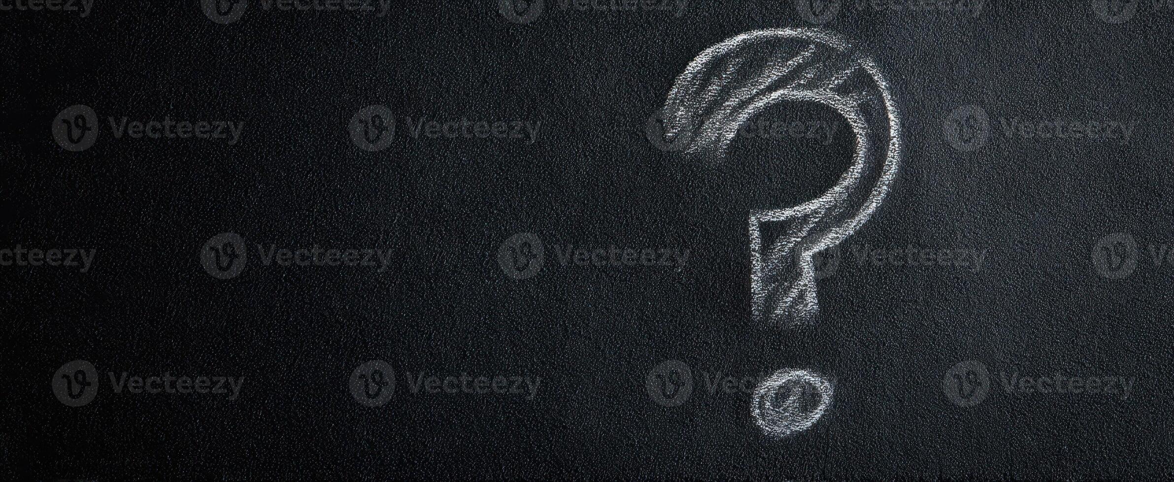 The question mark symbolizing curiosity and the quest for knowledge on a chalkboard. photo