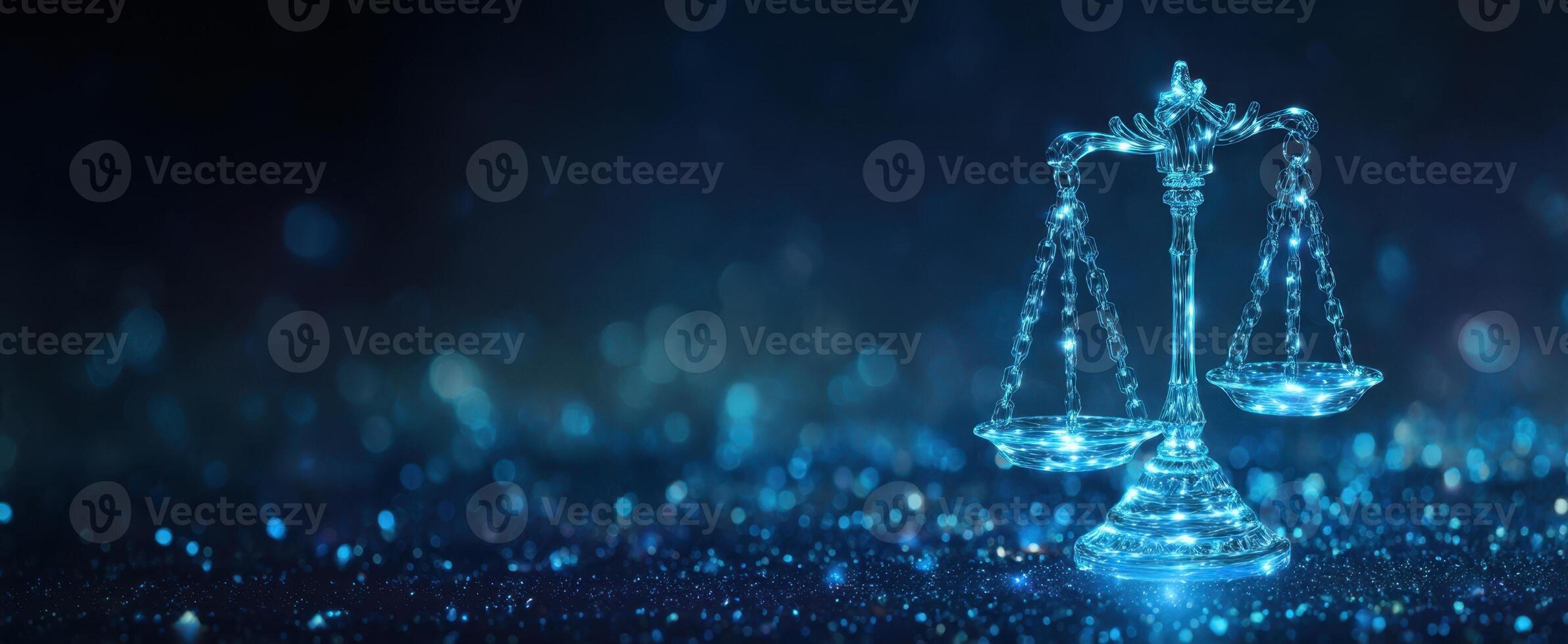 The elegant scales of justice illuminated in a shimmering blue background. photo