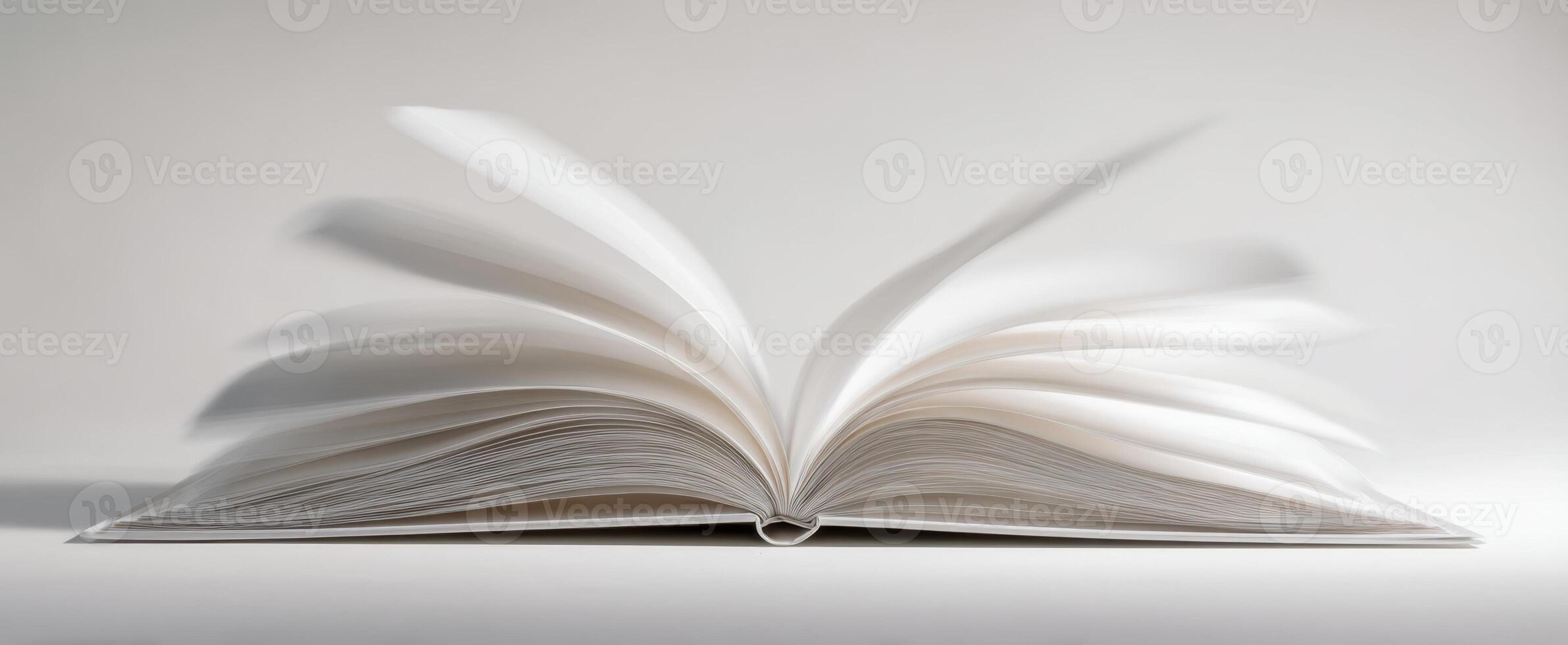 The open book with pages in motion on a minimalist background photo