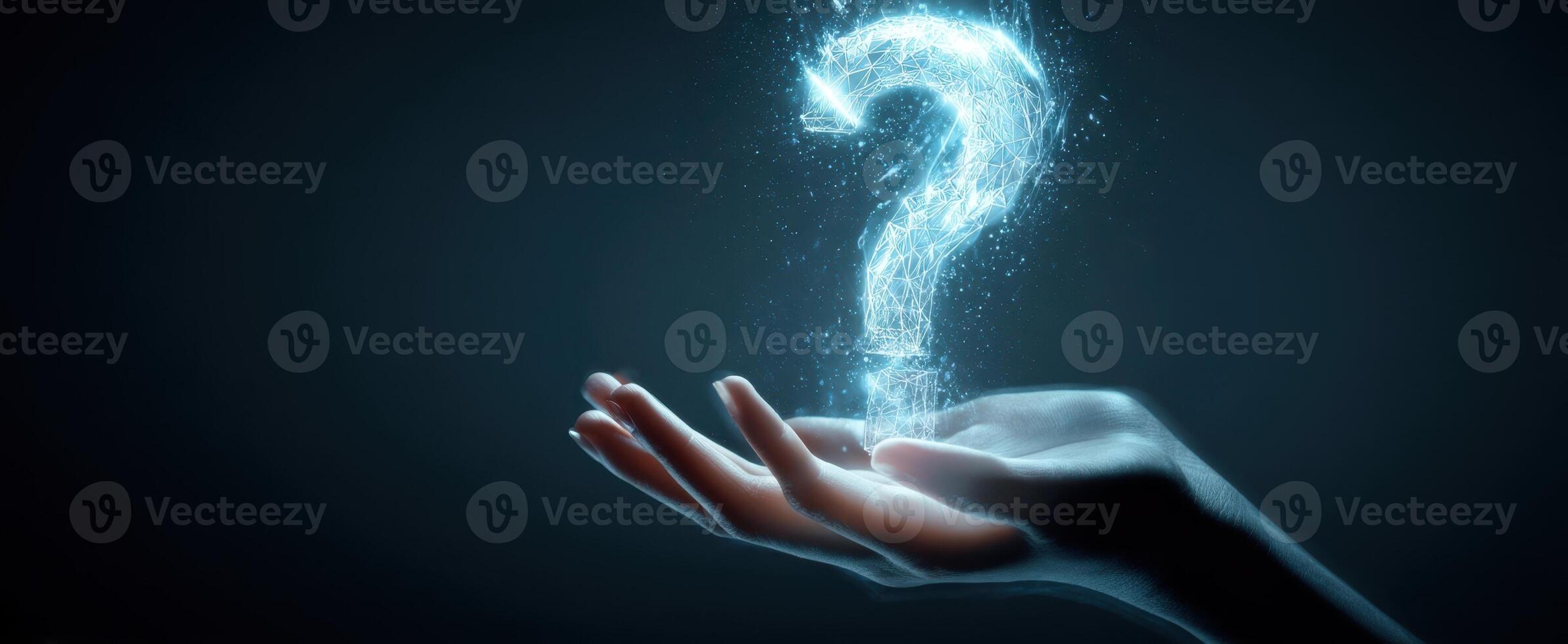 The Glowing Question Mark Floating Above a Hand in a Dark Environment. photo