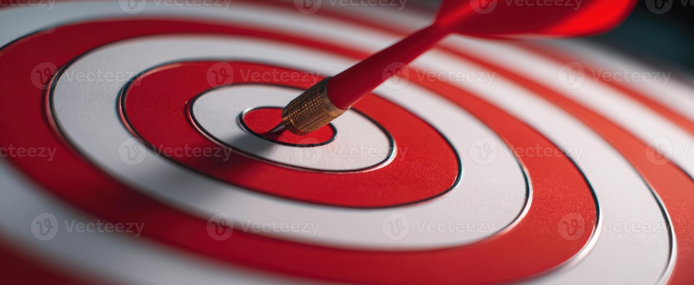 The dart hitting the bullseye on a target representing success and achievement. photo