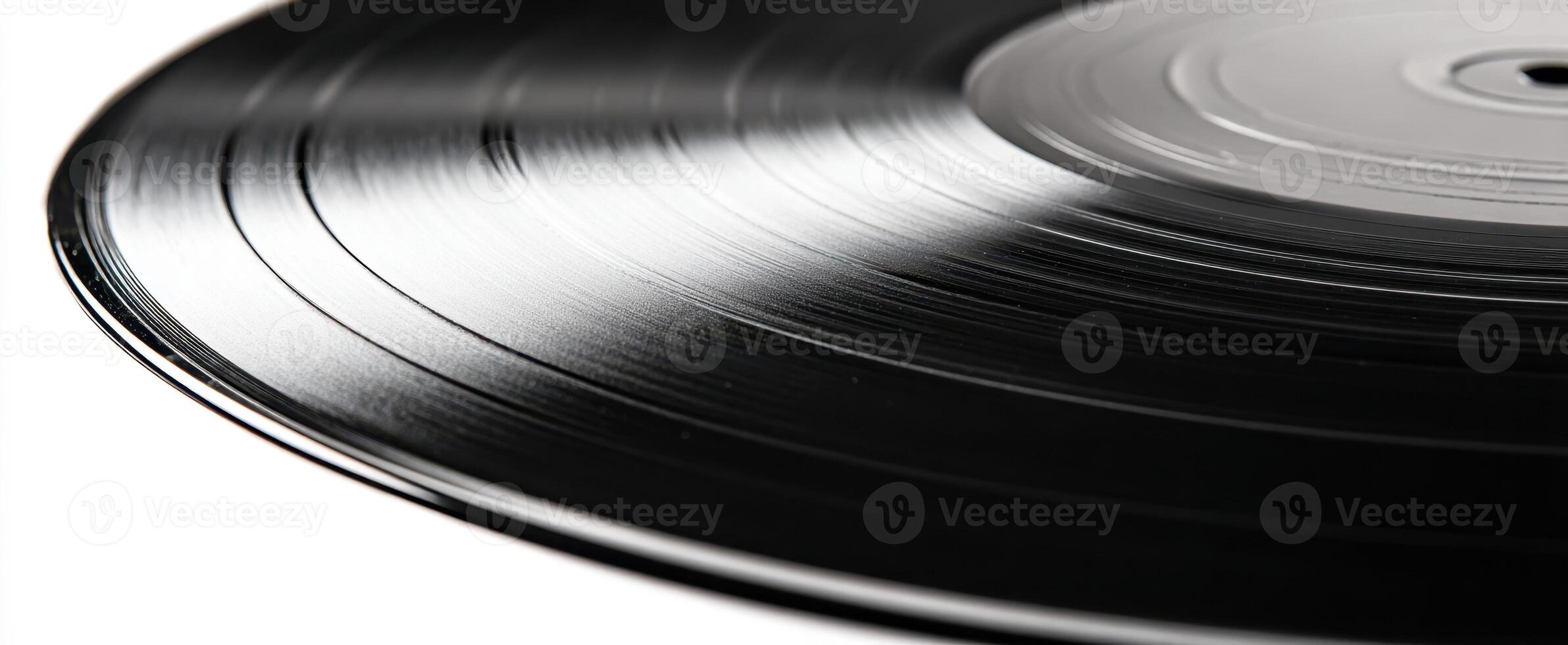 The classic vinyl record showcasing its elegant grooves and shiny surface. photo