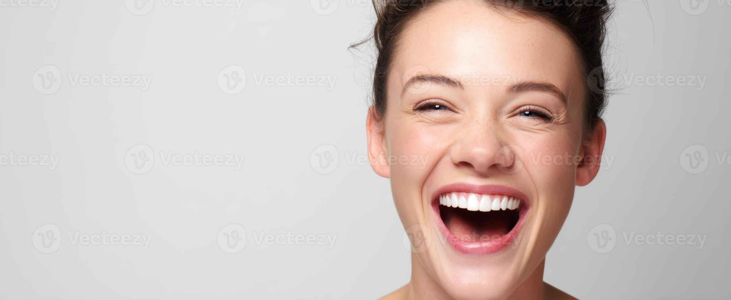The joyful woman exuding happiness and confidence through her vibrant smile. photo