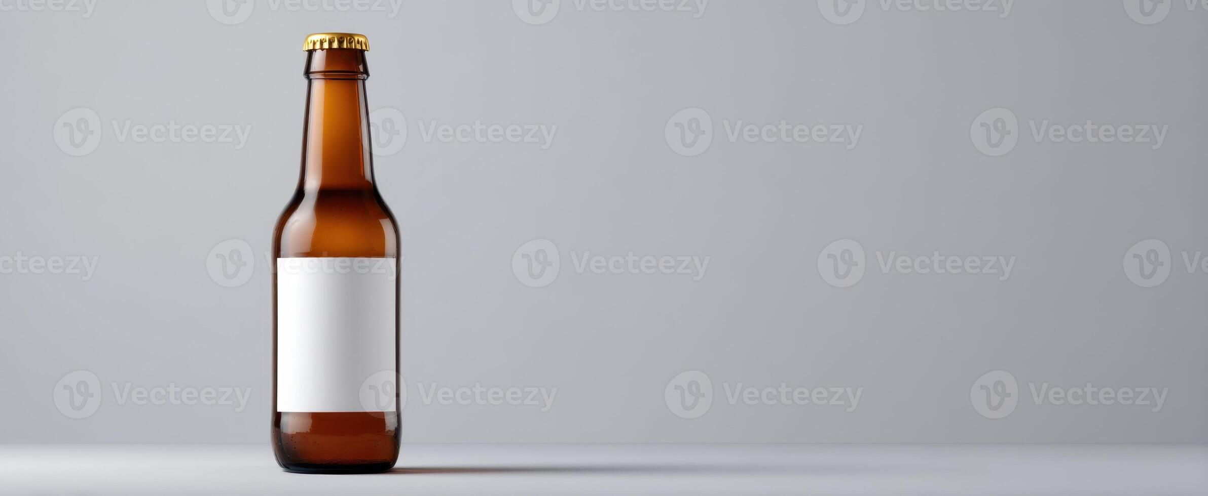 The amber beer bottle with a blank label on minimalist background. photo