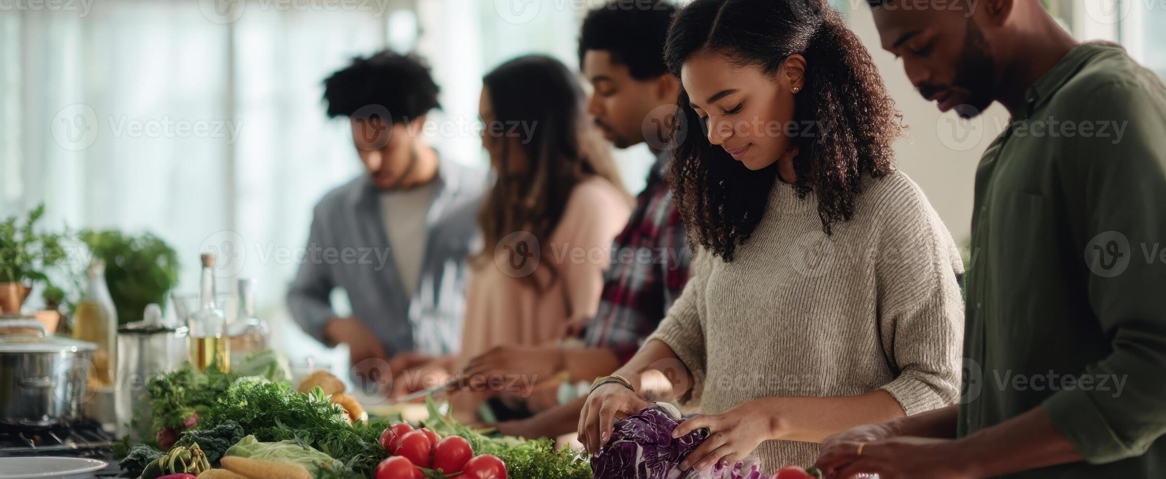The group preparing fresh vegetables together in a vibrant kitchen setting. photo