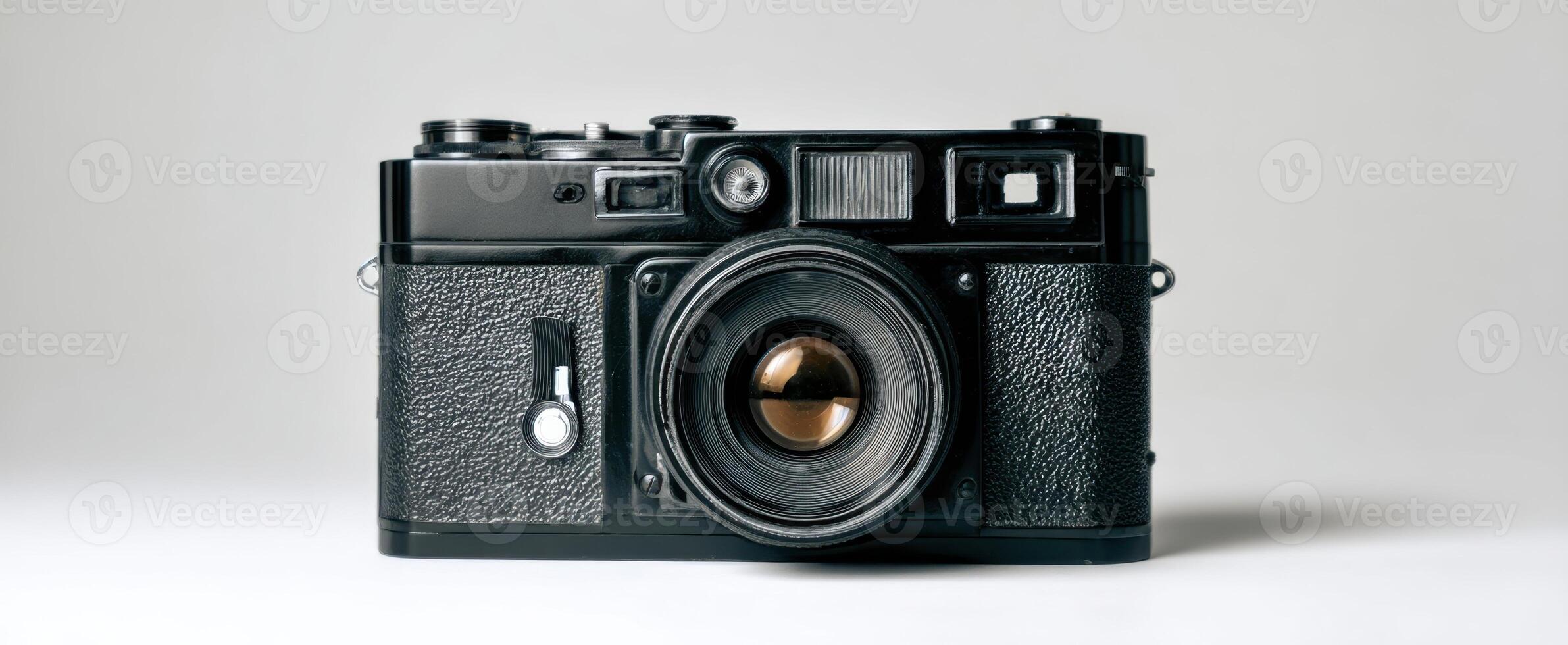 The vintage camera with classic design and charm against a minimalist backdrop. photo