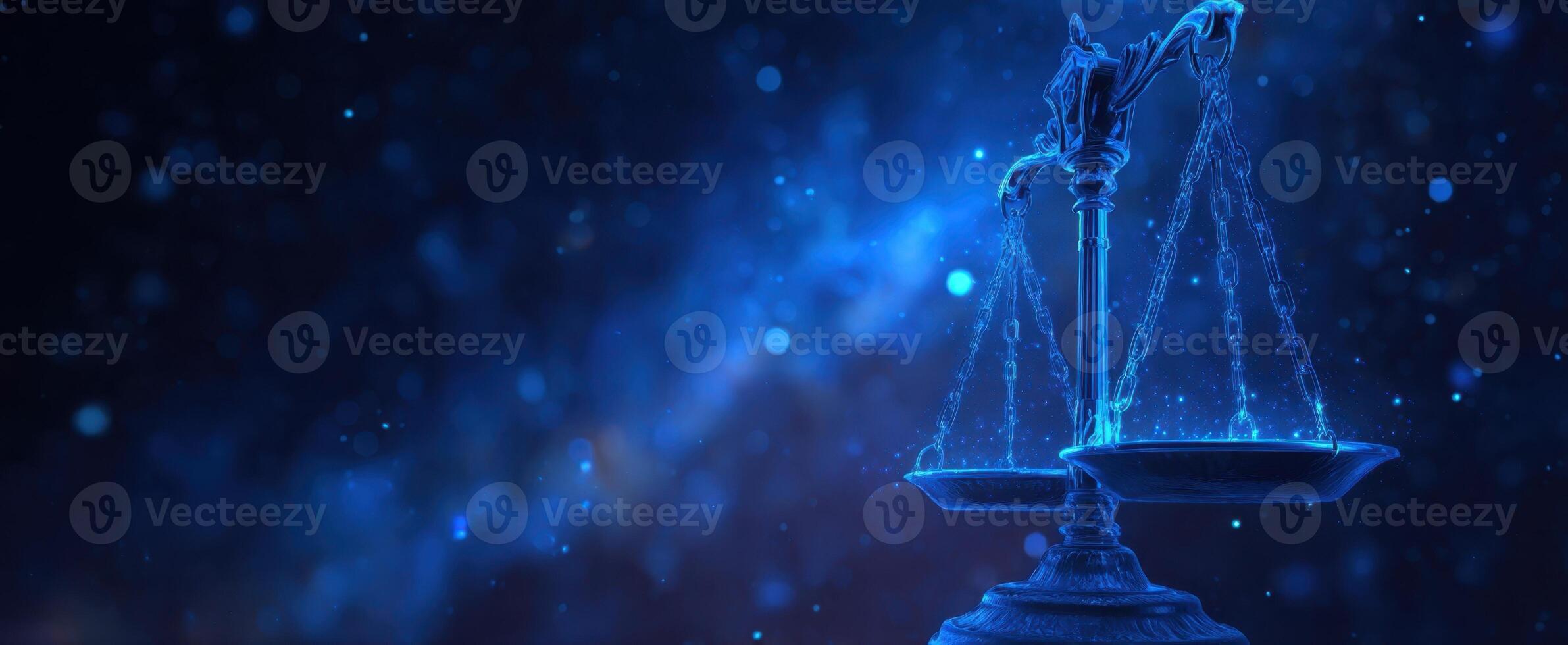 The scales of justice illuminated in a mesmerizing blue abstract background. photo