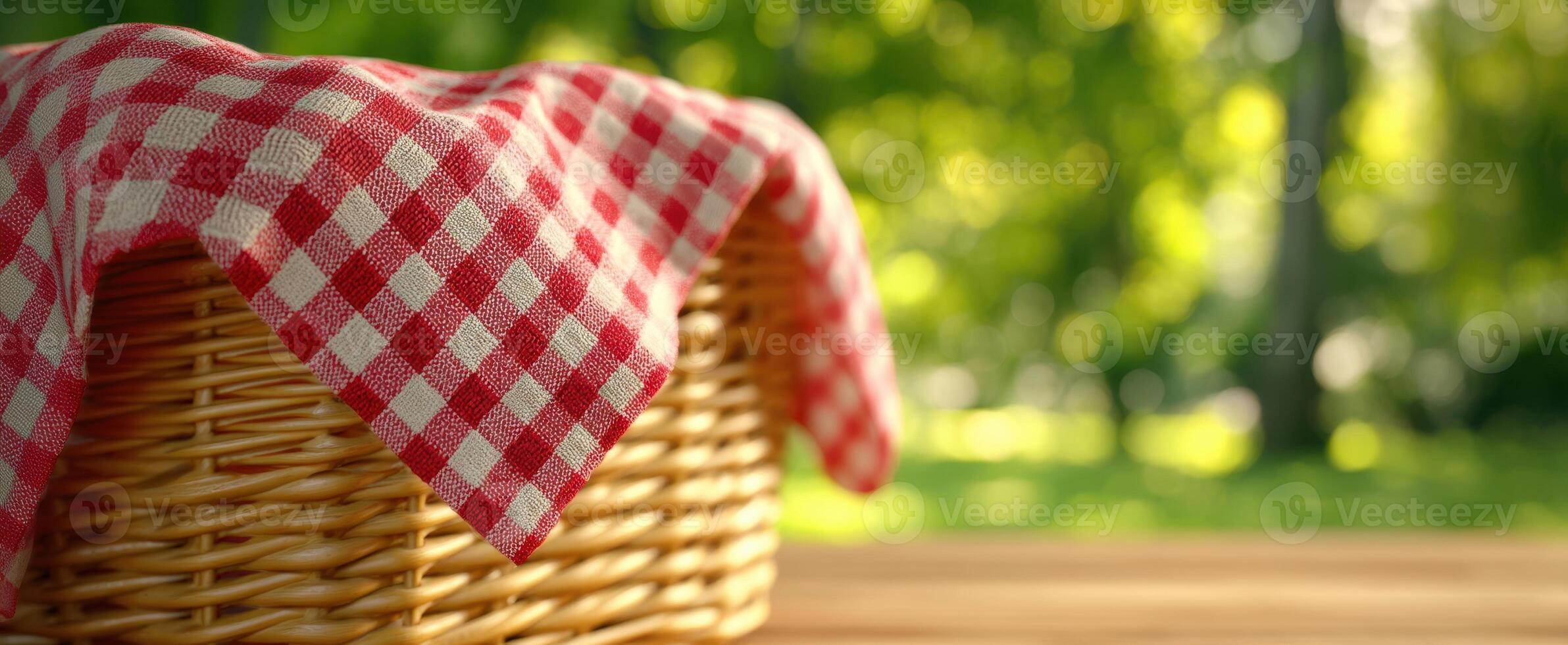 The inviting picnic basket adorned with a cheerful checkered cloth in nature. photo