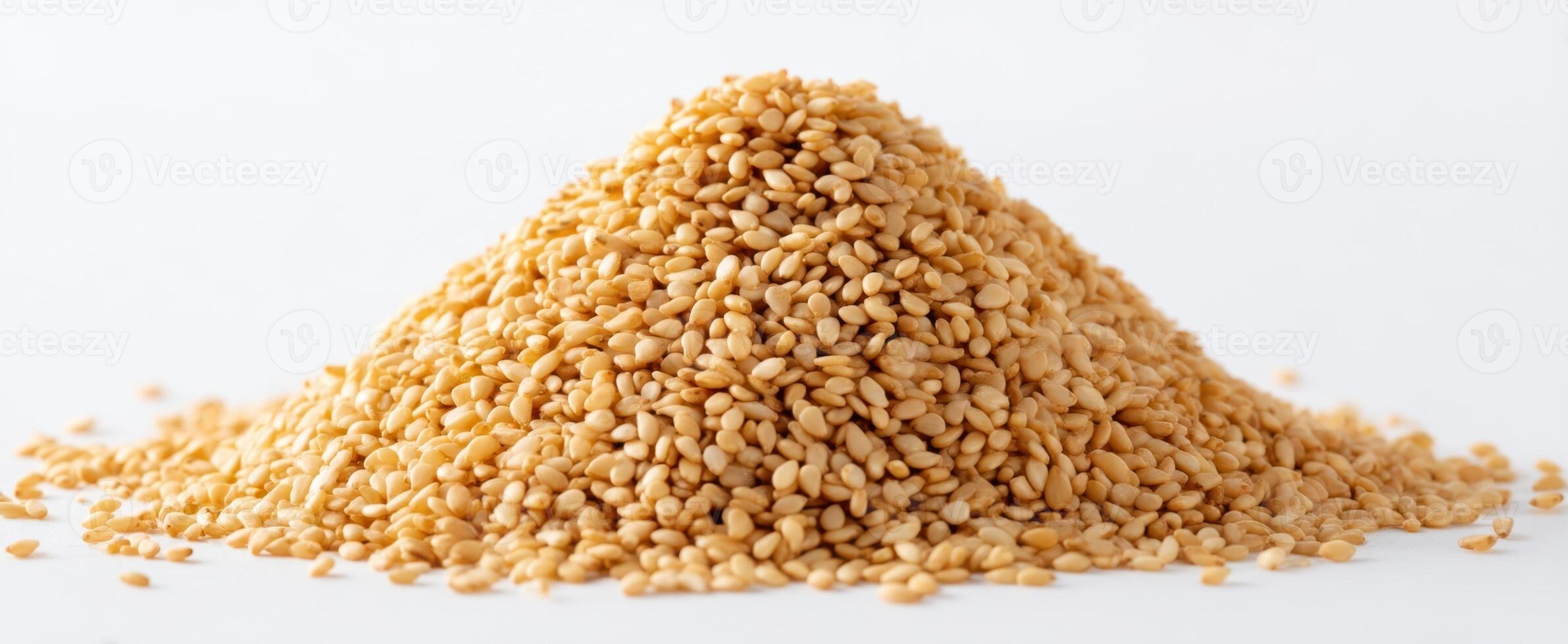 The pile of golden sesame seeds ready for culinary use photo