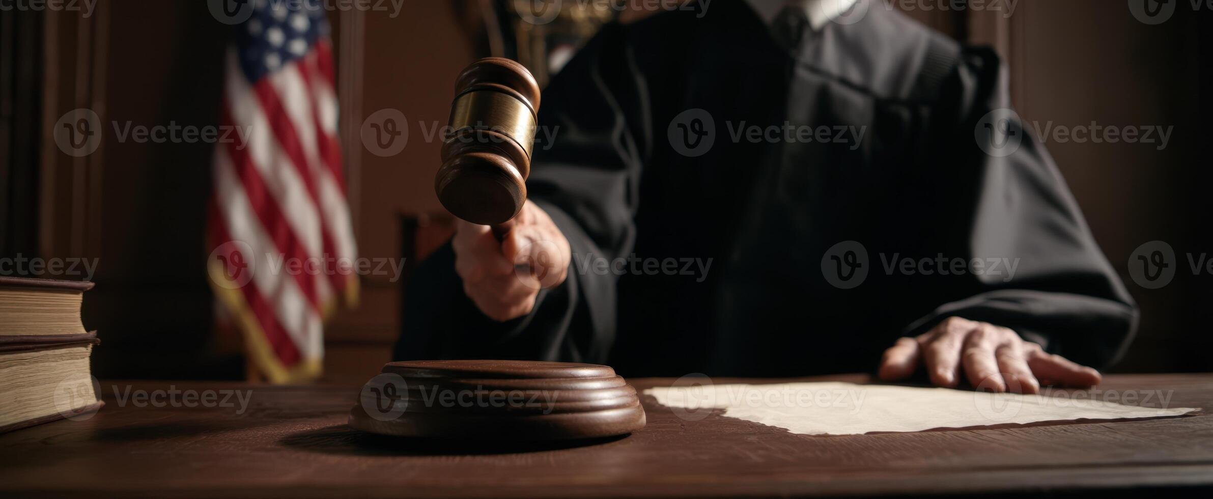 The judge presiding over a court session with gavel and American flag. photo