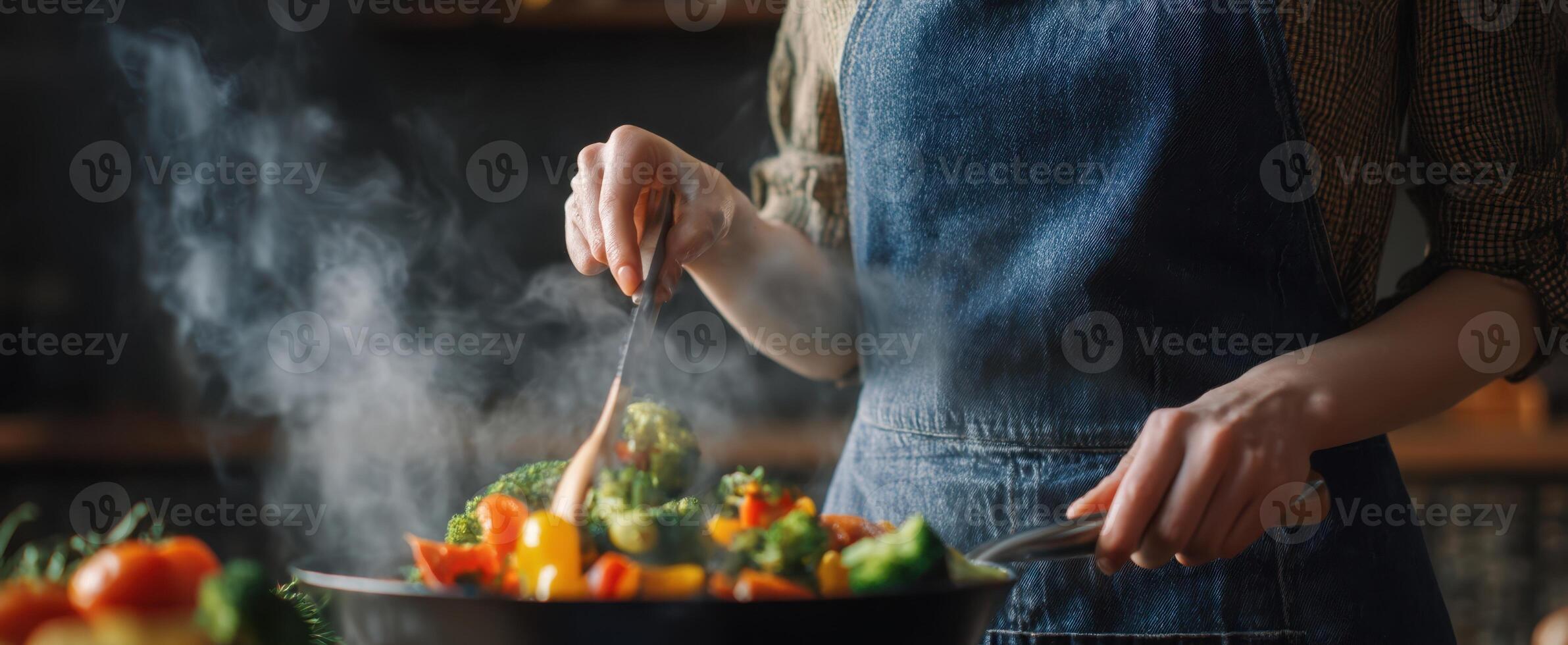 The chef skillfully prepares a delicious medley of fresh vegetables in the kitchen. photo