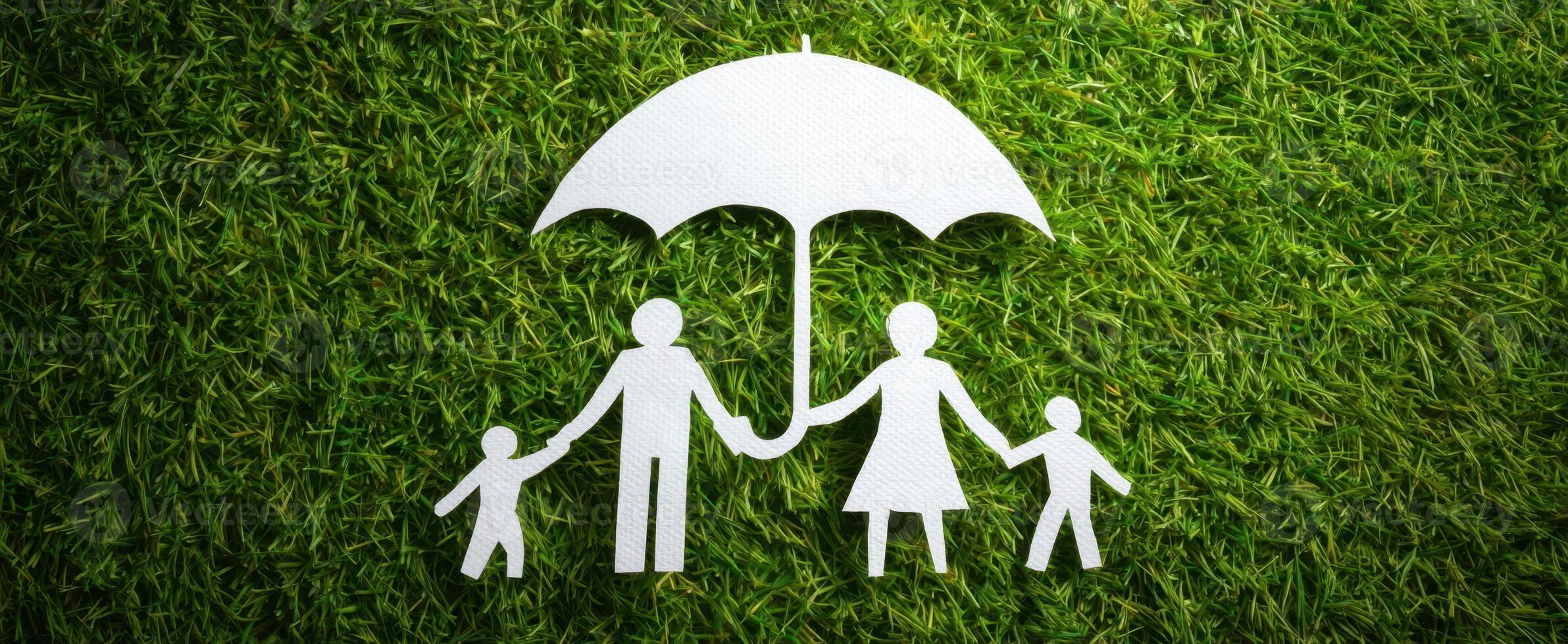 The paper family under an umbrella symbolizing protection and togetherness. photo