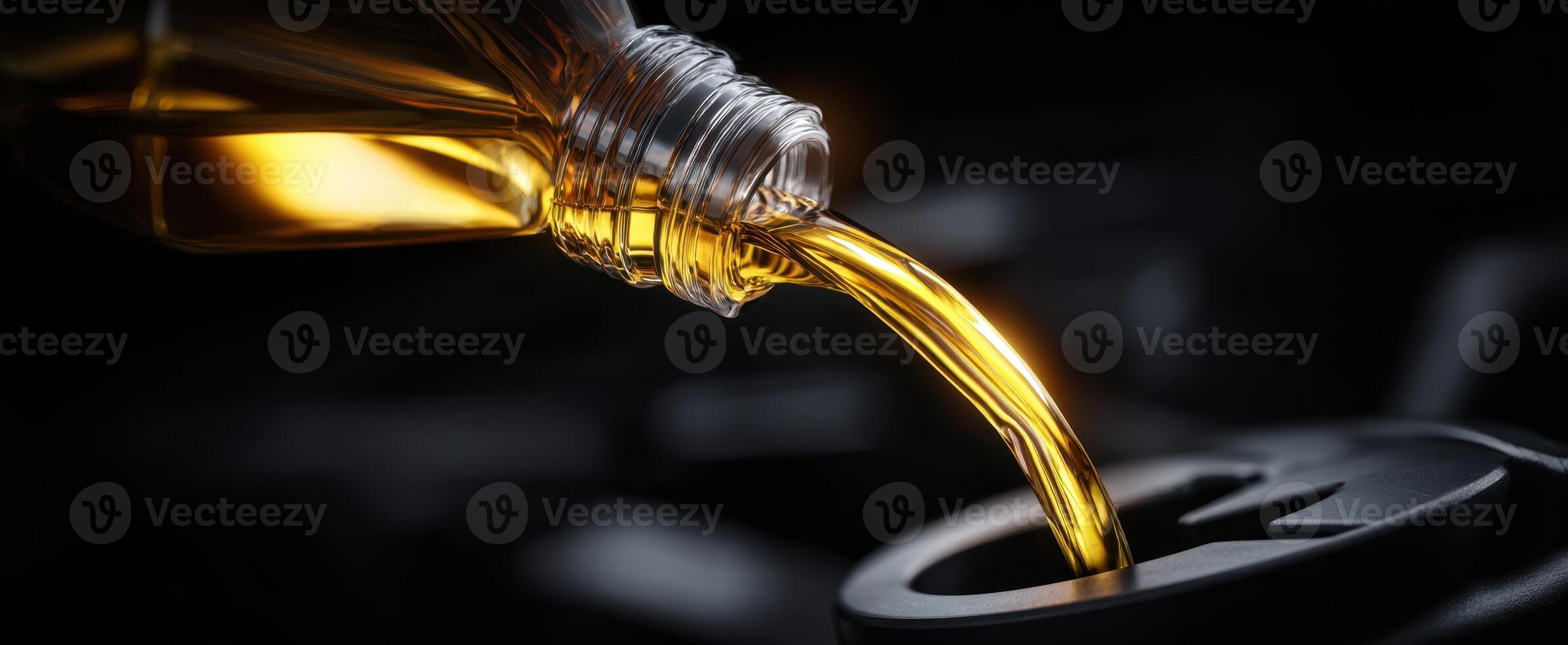 The oil being poured into a vehicle engine for maintenance purpose. photo