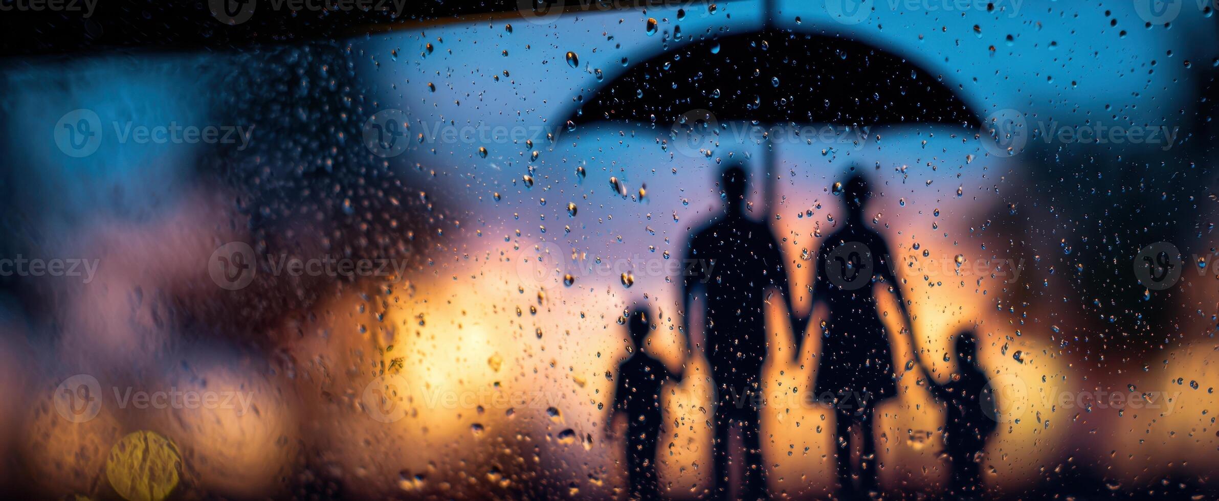 The family sharing a moment under an umbrella during a rainy evening. photo