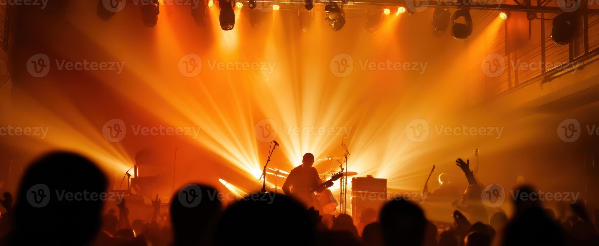 The captivating performance with energetic lights and enthusiastic crowd. photo