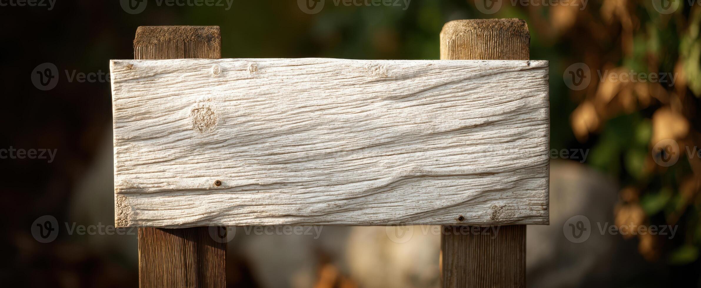 The rustic wooden sign with a textured surface for creative outdoor displays. photo