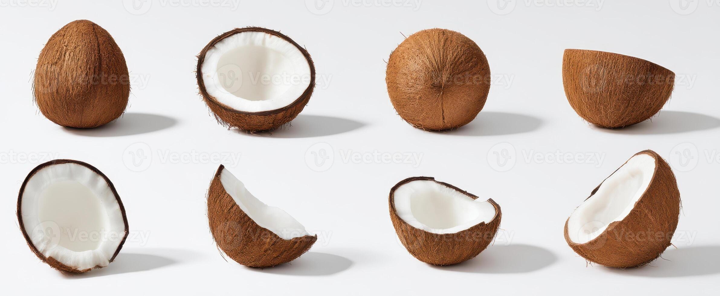 The collection of whole and halved coconuts on a white background. photo