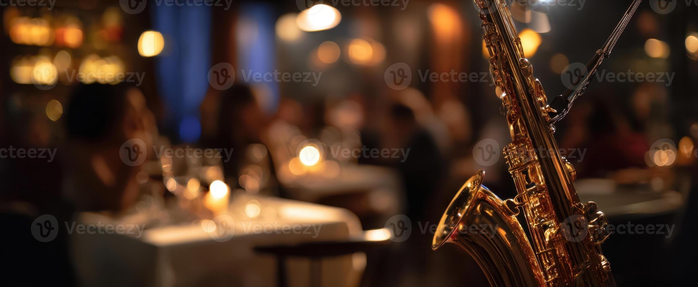 The saxophone illuminated in a cozy and elegant restaurant setting. photo