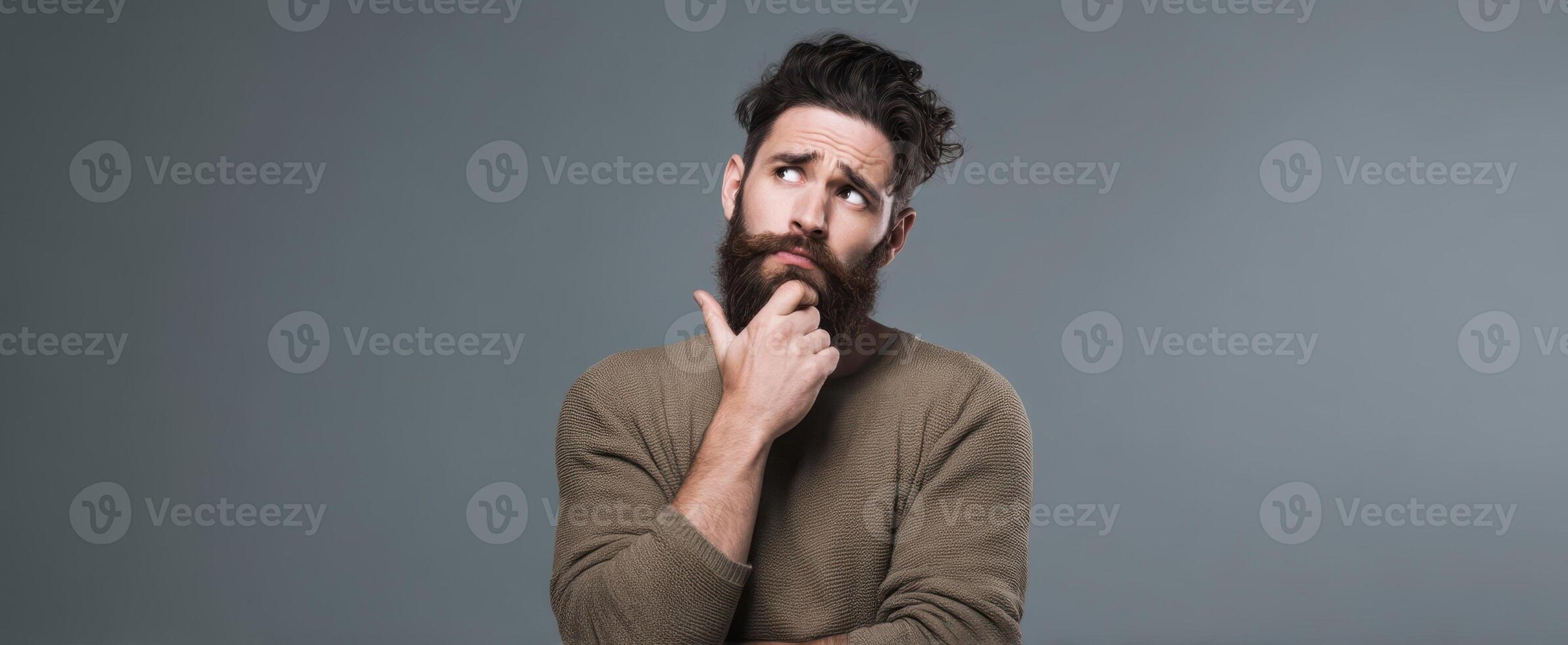 The thoughtful man pondering life's questions with a curious expression. photo