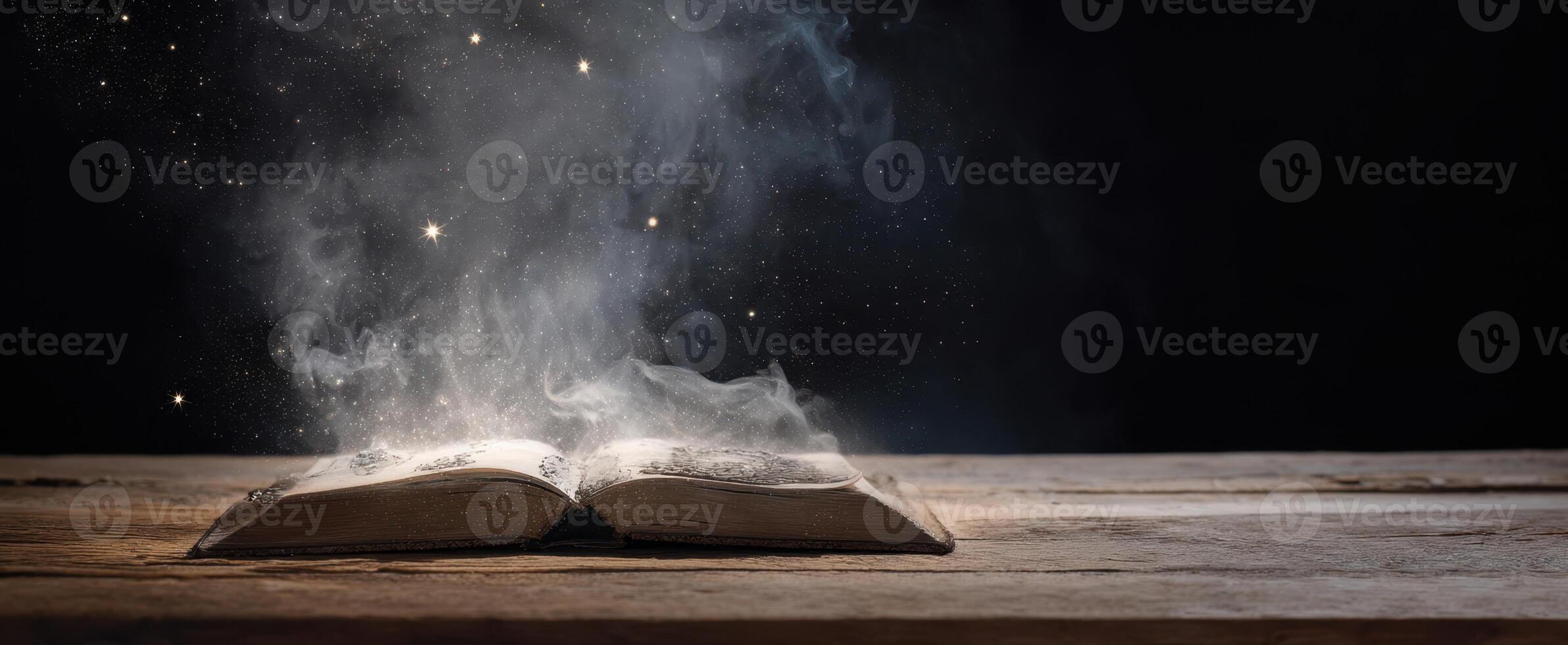 The book releasing magic and sparks into the dark night atmosphere. photo