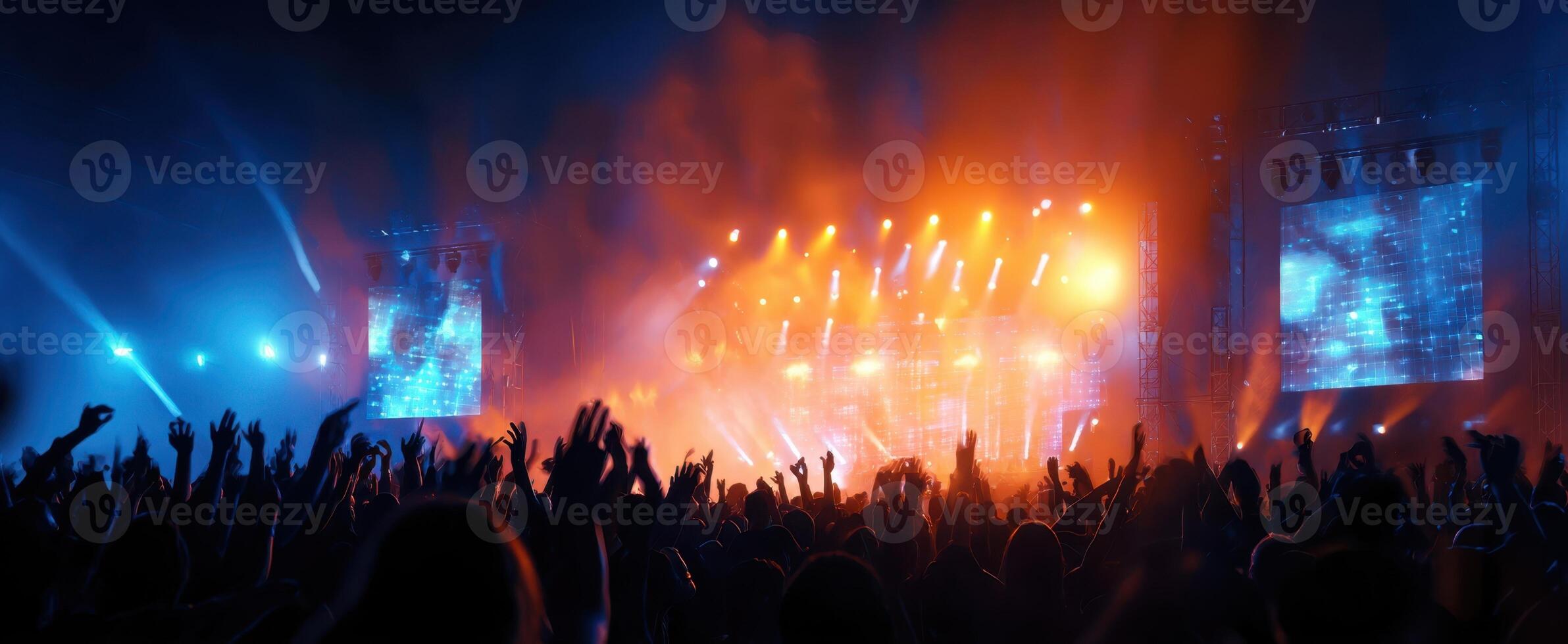 The exhilarating concert atmosphere with vibrant lights and a cheering crowd. photo