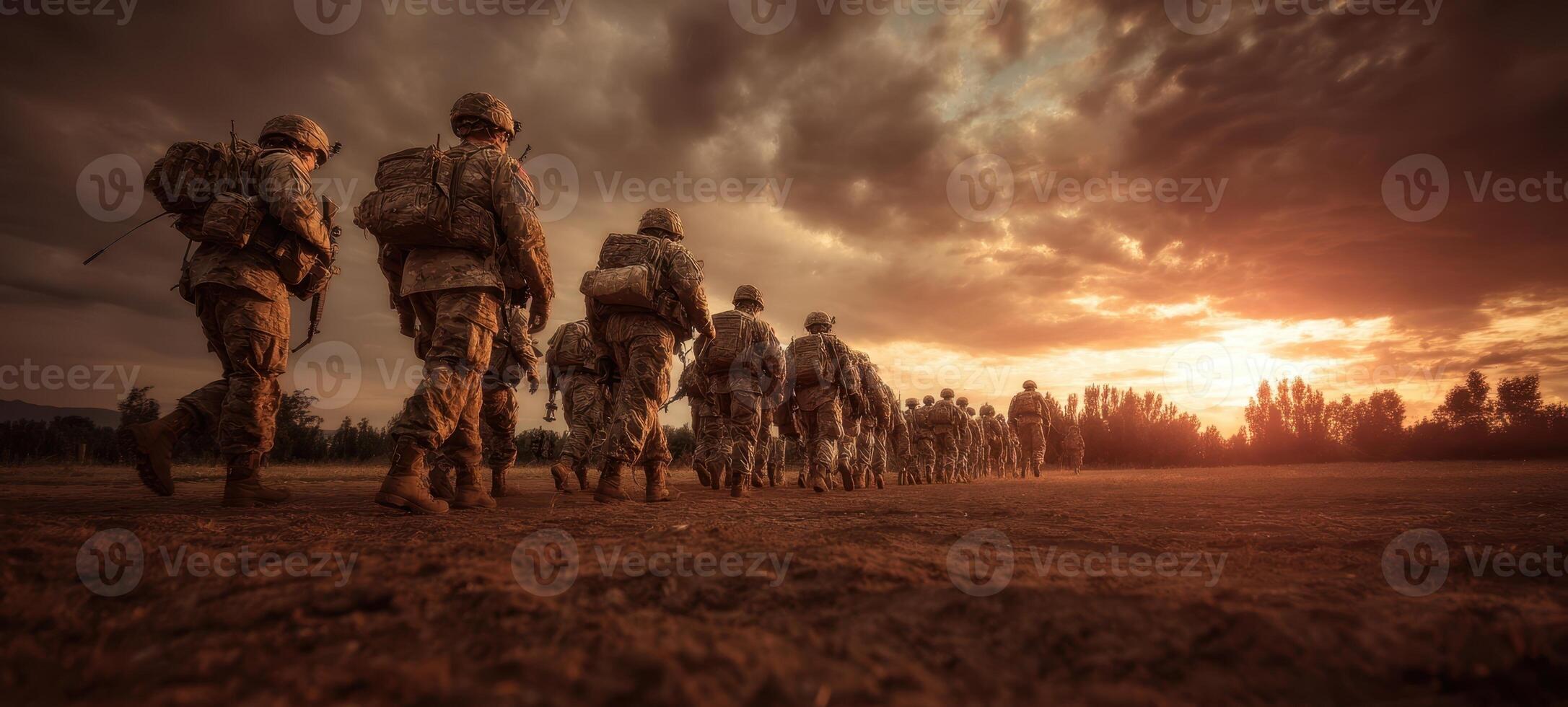 The soldiers marching into the sunset with determination and unity. photo