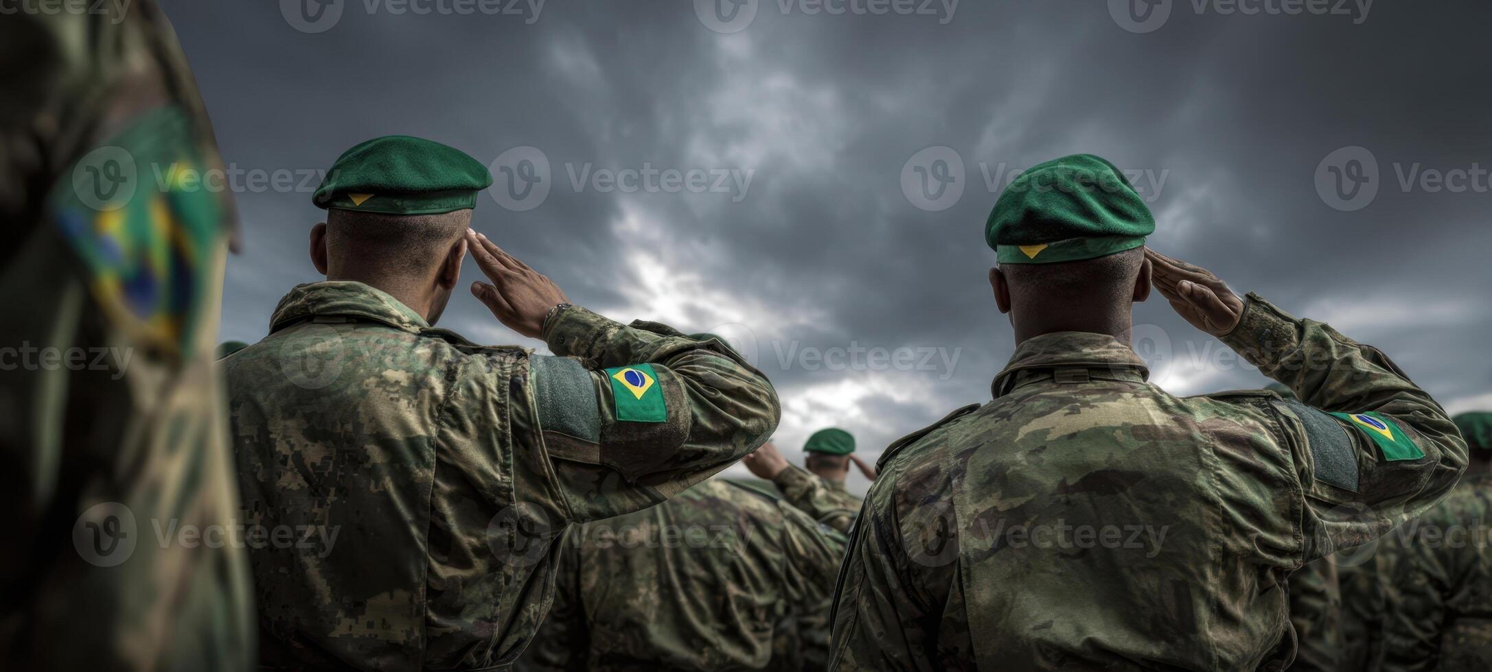 The soldiers saluting under a dramatic sky during a military ceremony. photo