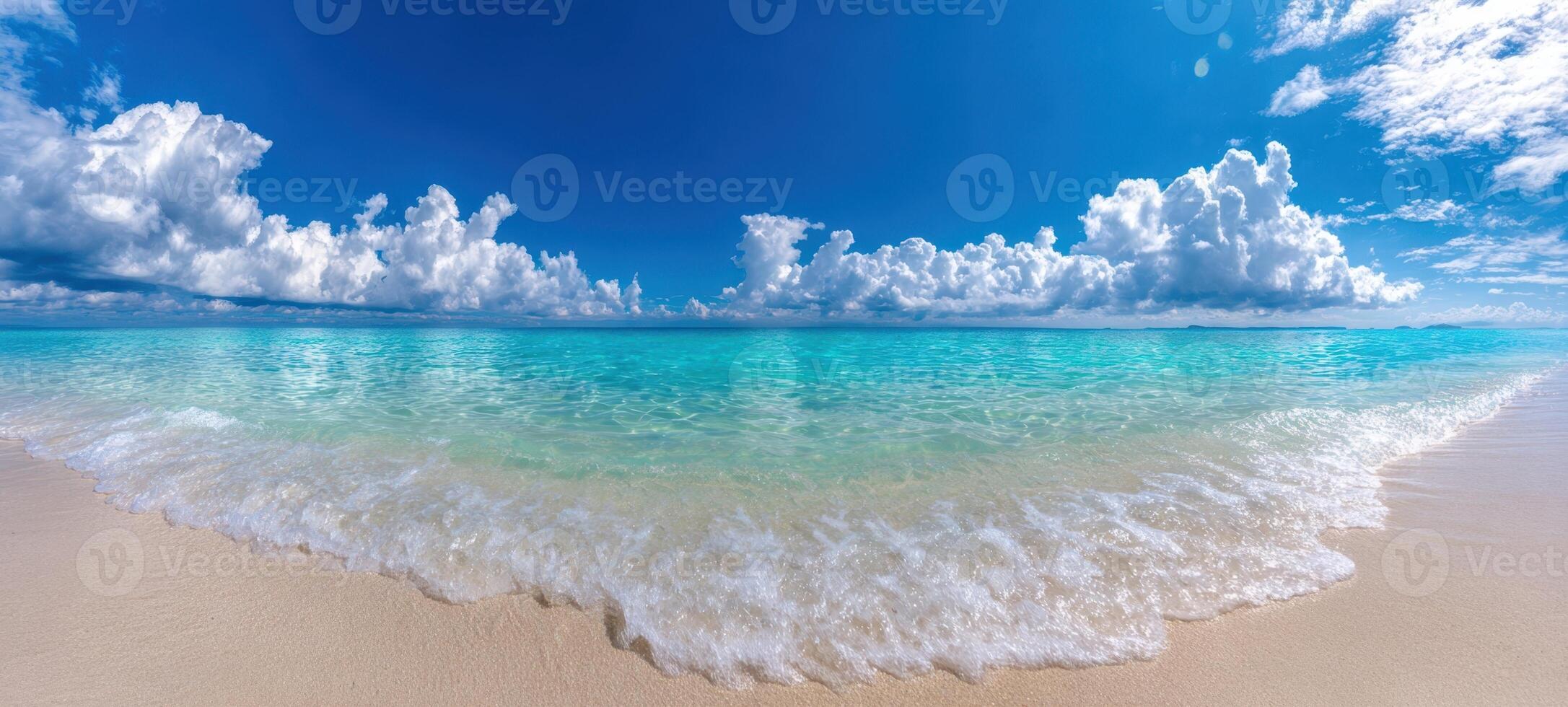 The serene ocean view with turquoise waters and fluffy white clouds. photo