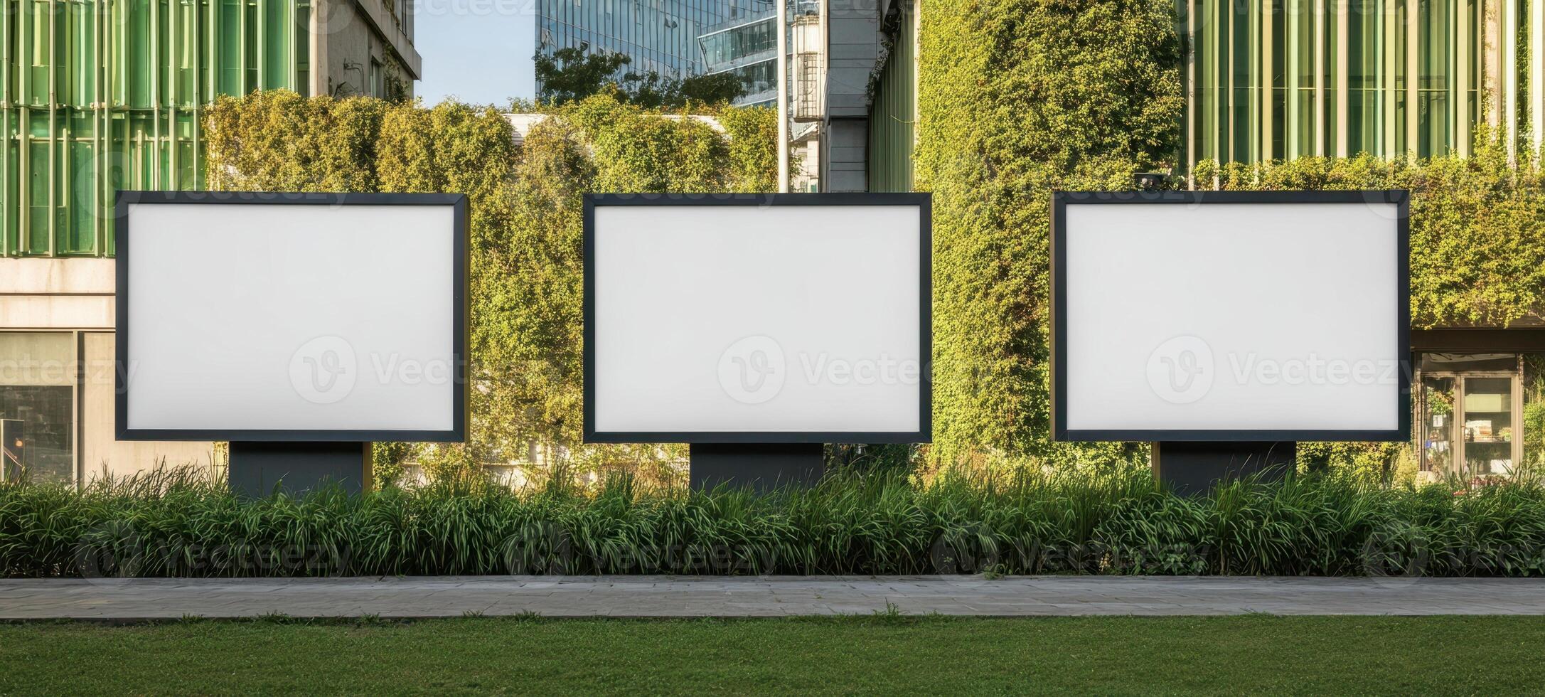 The empty billboards framed by lush greenery in an urban environment. photo