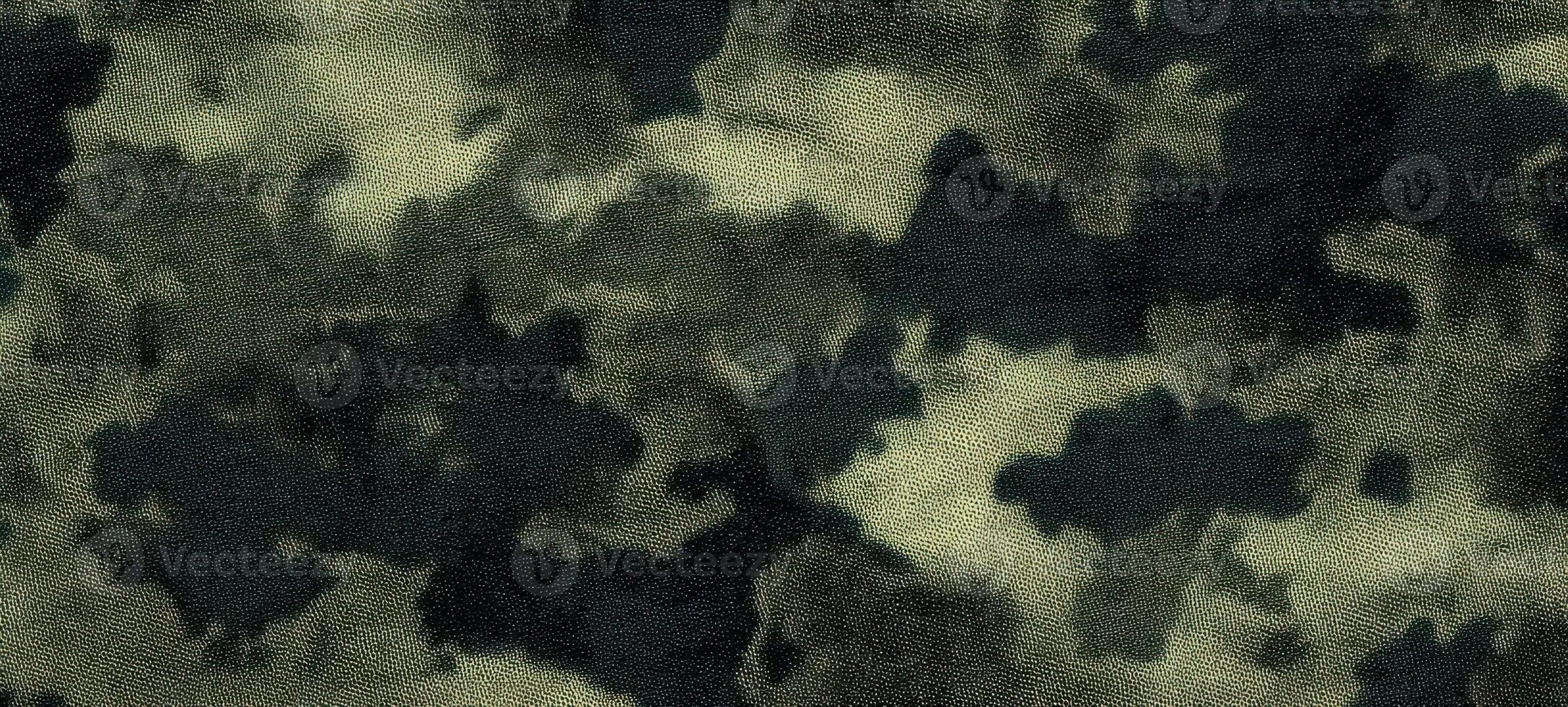 The textured camouflage pattern featuring shades of green and black. photo