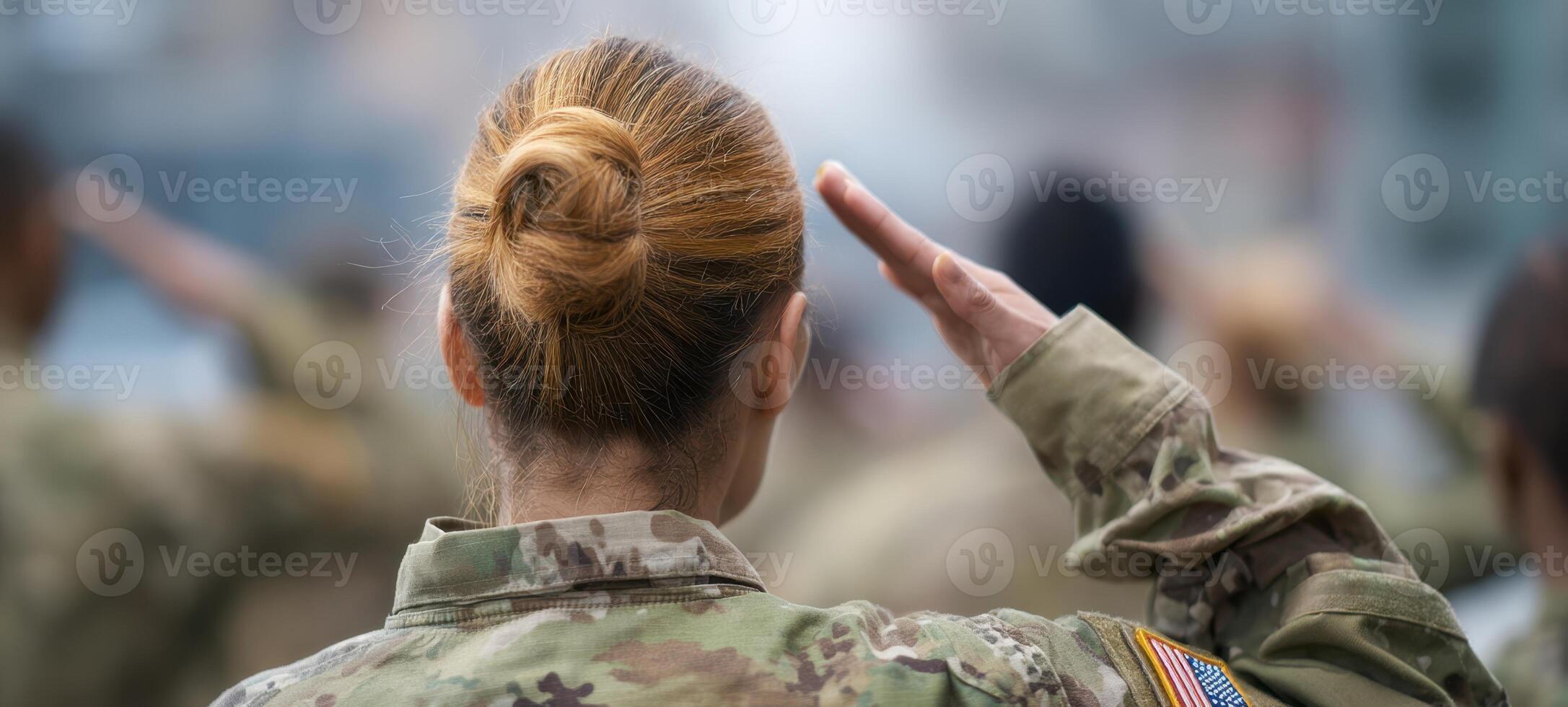 The soldier saluting in military uniform during a ceremonial event. photo