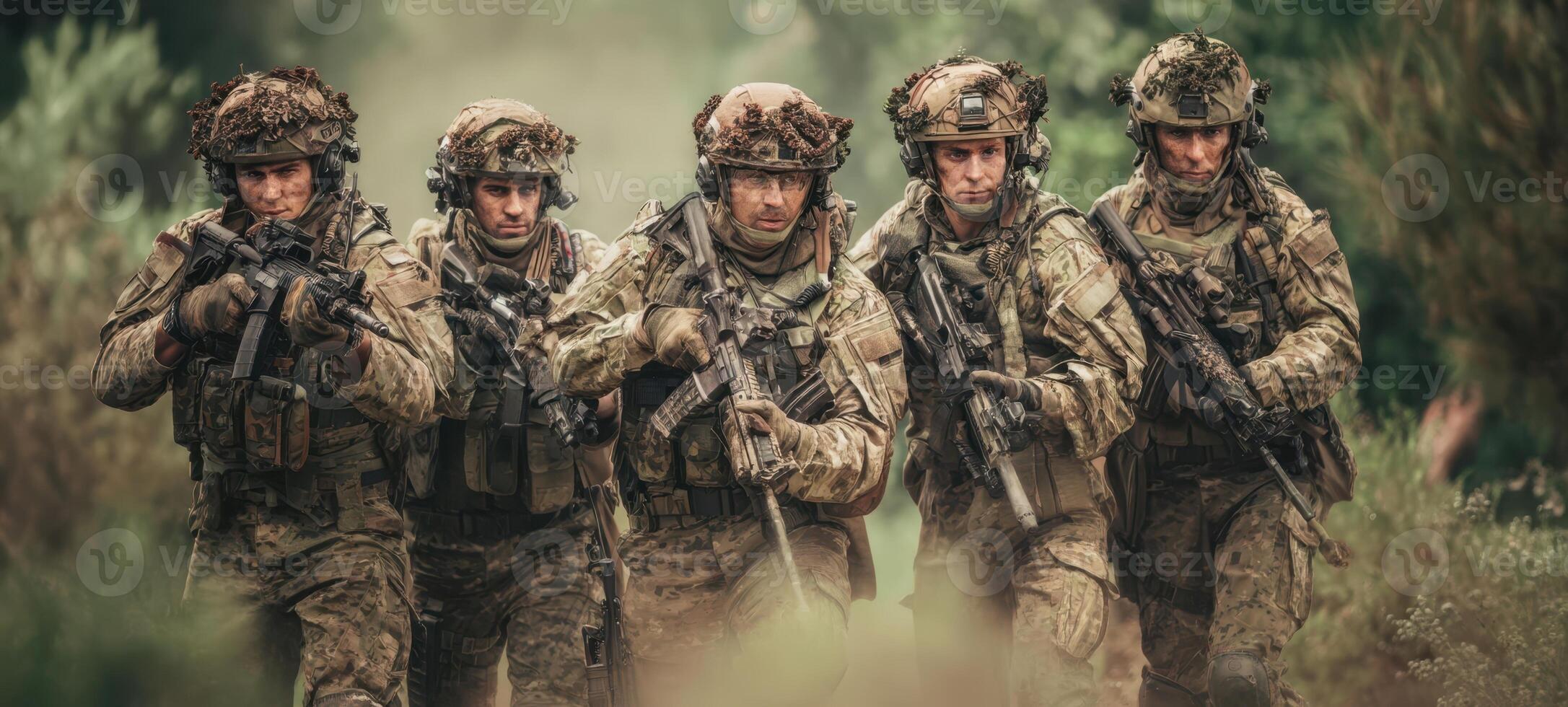 The soldiers advancing through the forest in tactical formation during a military operation. photo