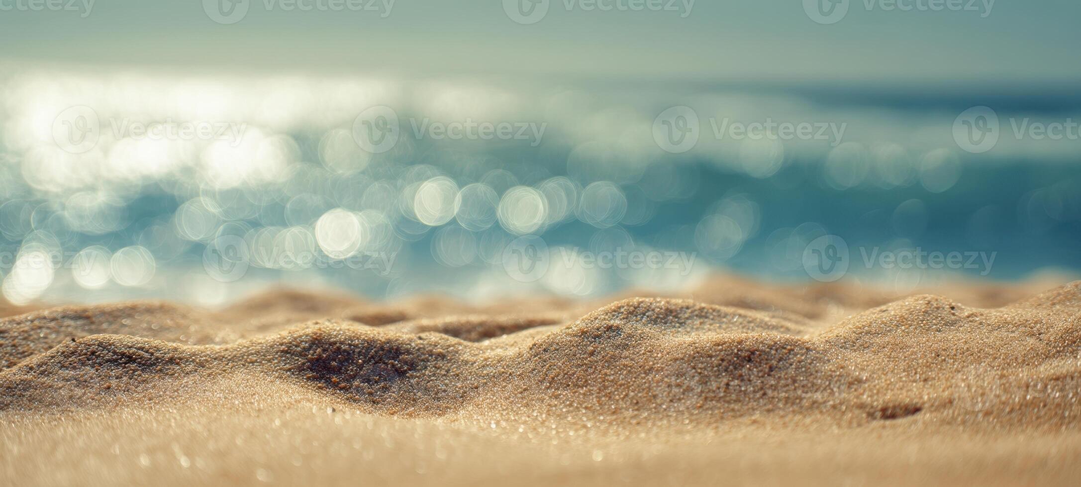 The Tranquil Beach Scene with Soft Sand and Blurry Ocean Waves photo